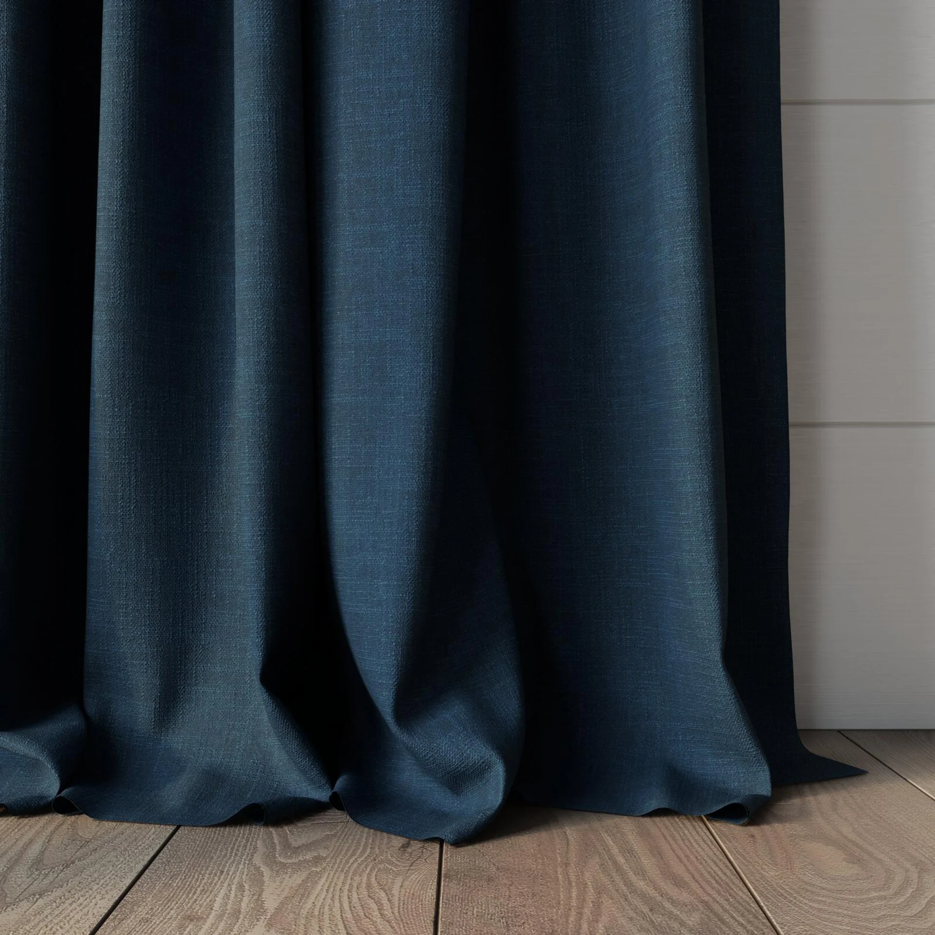 Bottom view of Mauritius Denim, puddled, on curtain rod