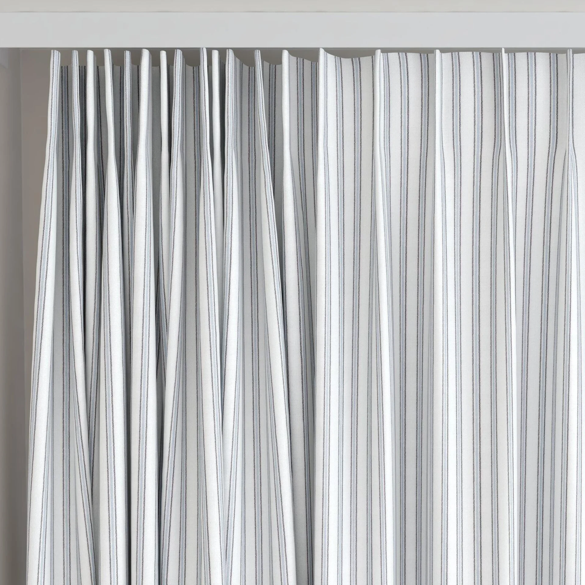 Top view of Chambray Ticking Sky Blue, on curtain rail