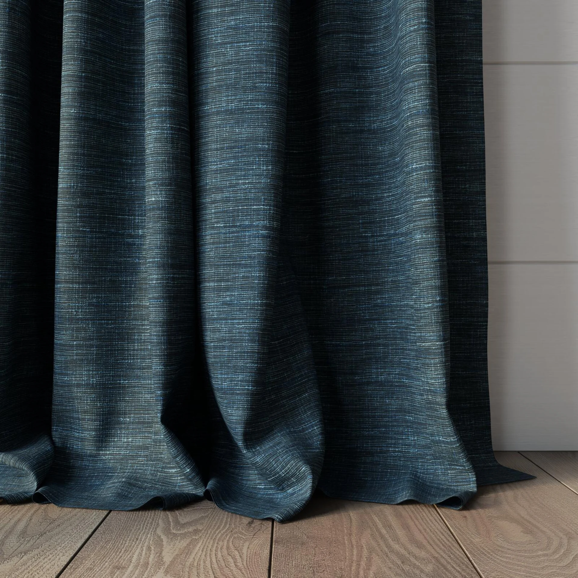Bottom view of Venus Denim, puddled, on curtain rod