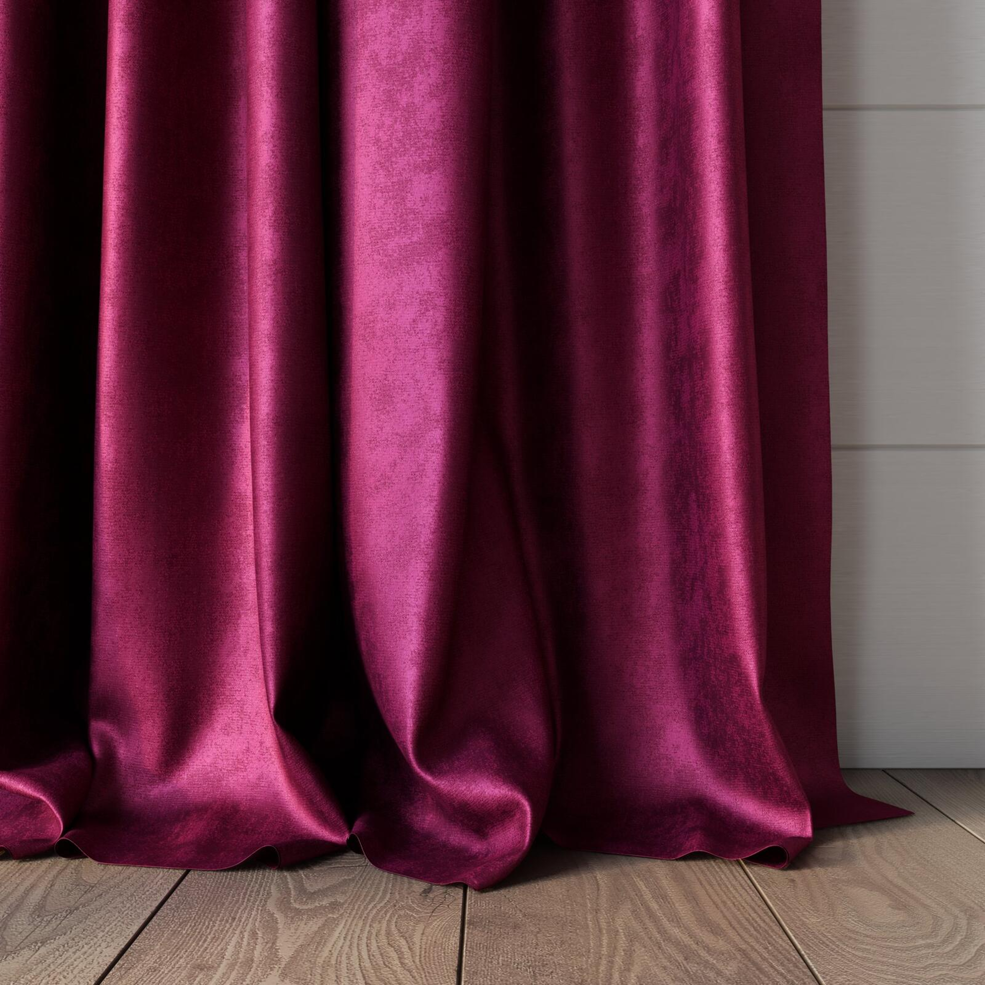 Bottom view of Fizz Magenta, puddled, on curtain rod