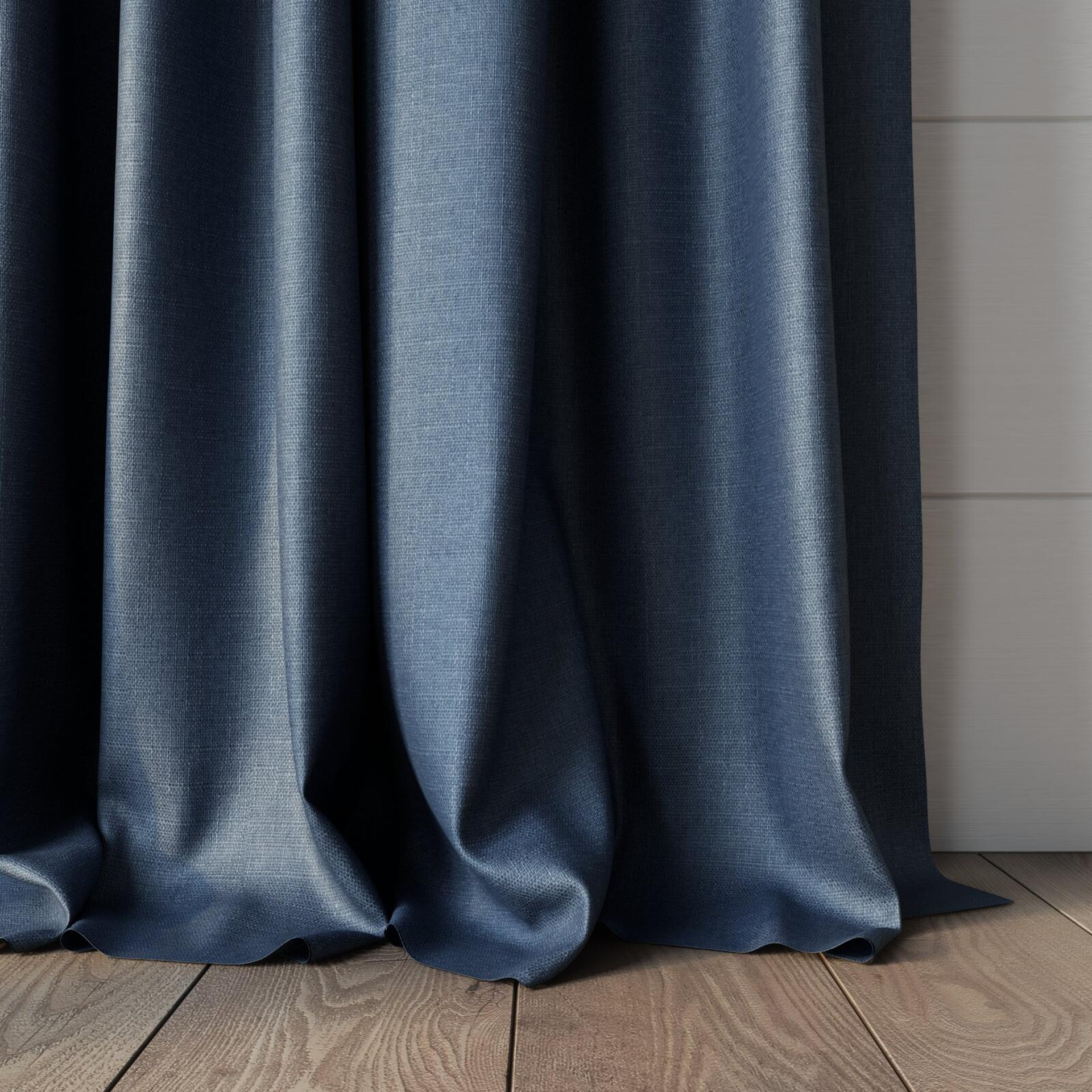 Bottom view of Tonga Denim, puddled, on curtain rod