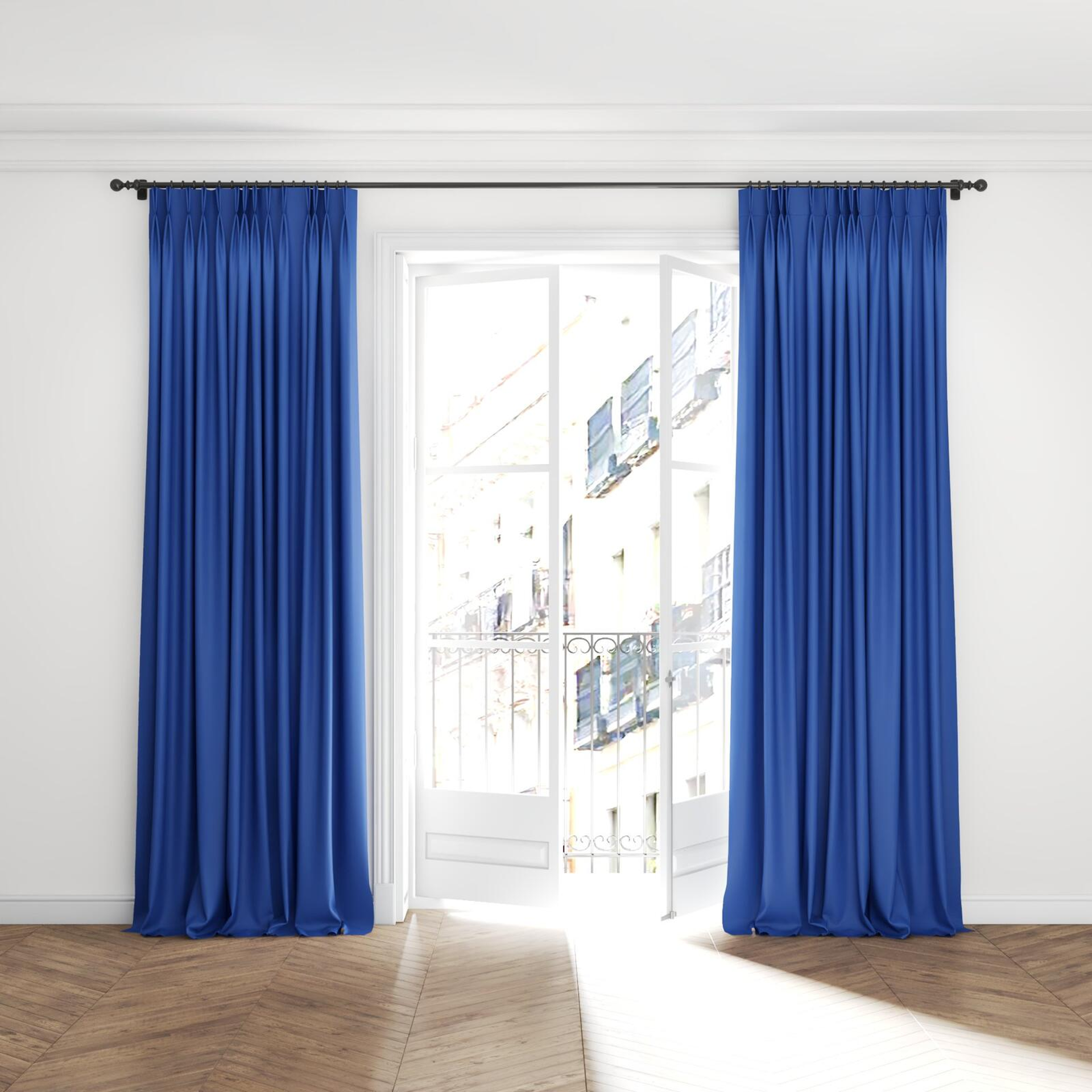 Full view of Ultra Dim Indigo, puddled with pinch pleat, on curtain rod
