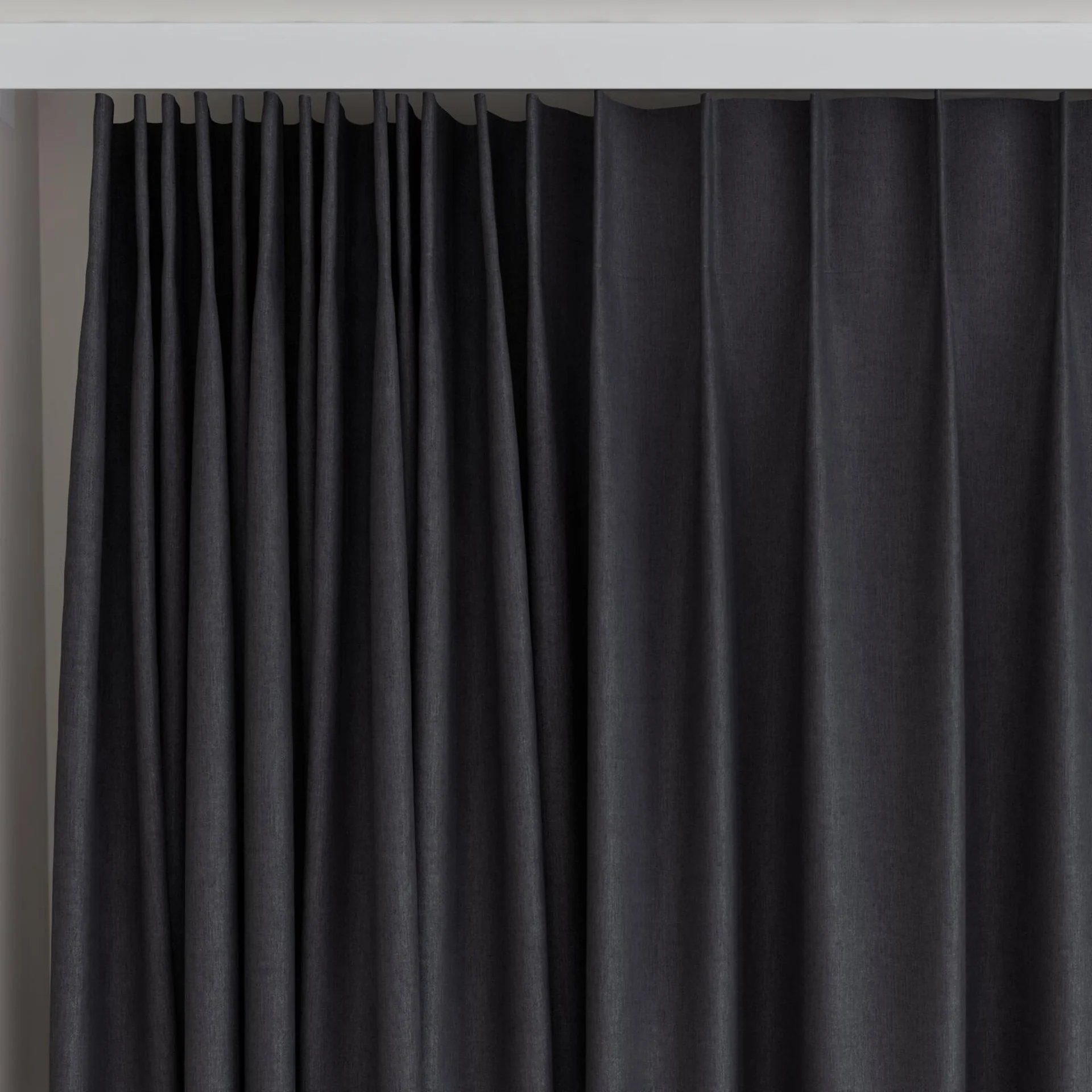 Top view of Cushy Raven, on curtain rail