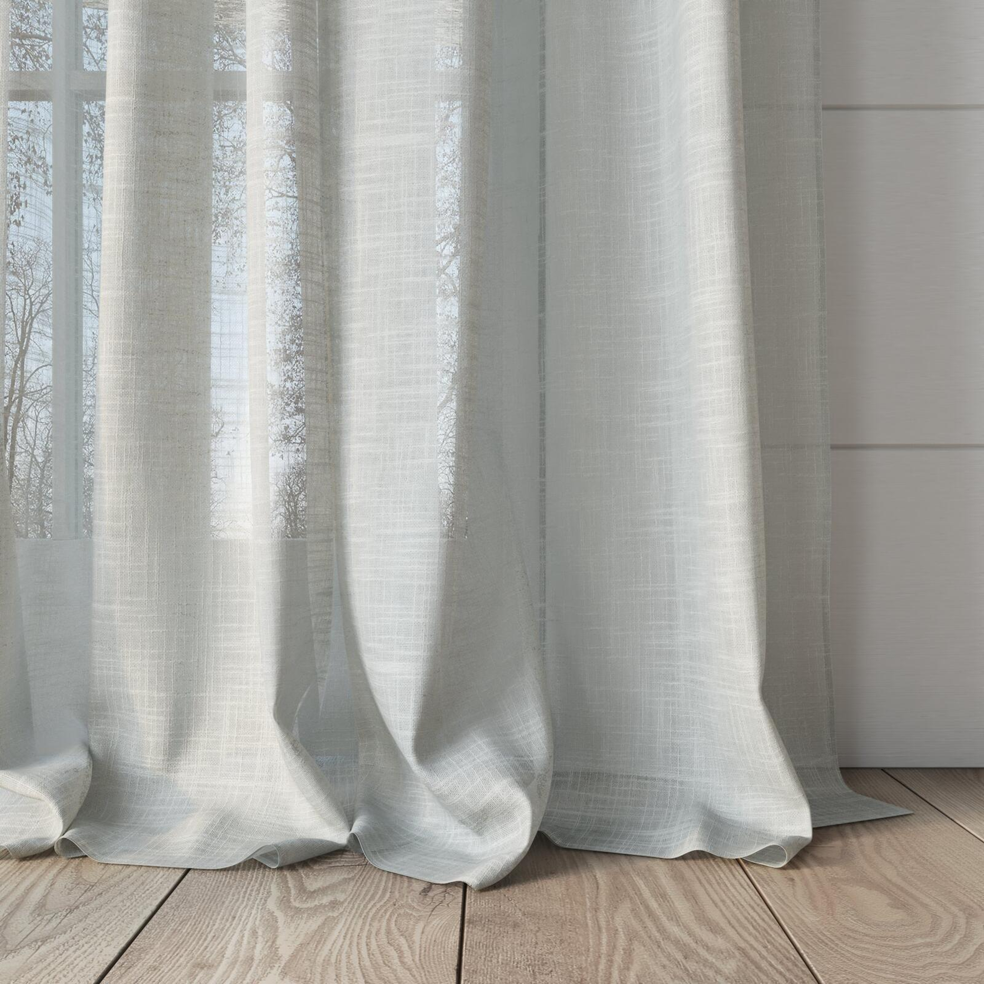 Bottom view of Savina Wool, puddled, on curtain rod
