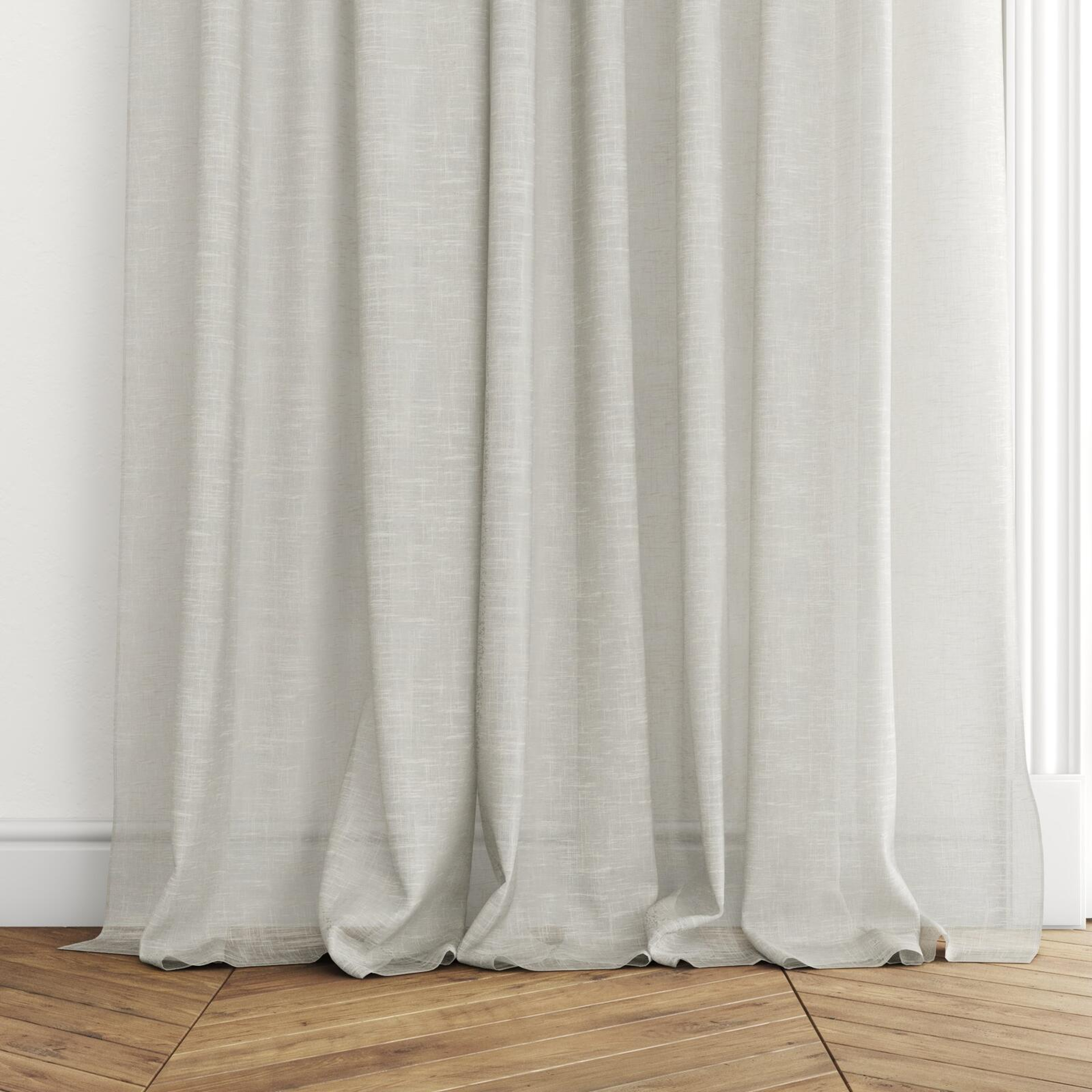 Bottom view of Savina Sand, puddled with pinch pleat, on curtain rod