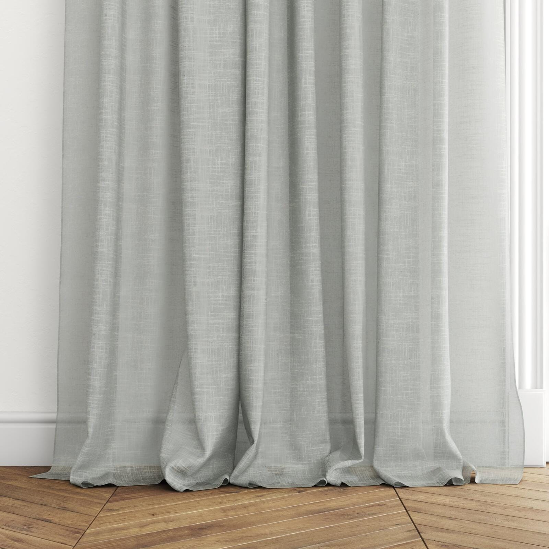 Bottom view of Savina Celadon, puddled with pinch pleat, on curtain rod