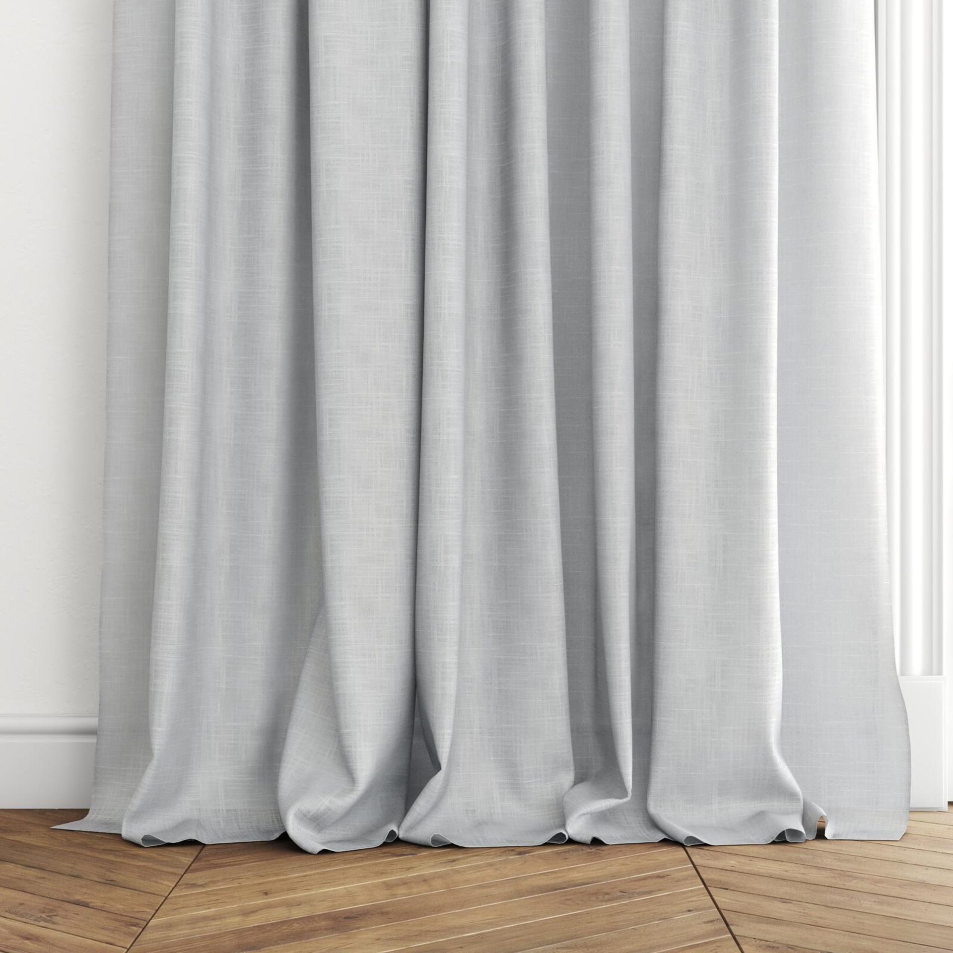Bottom view of Charanga Sky, puddled with pinch pleat, on curtain rod