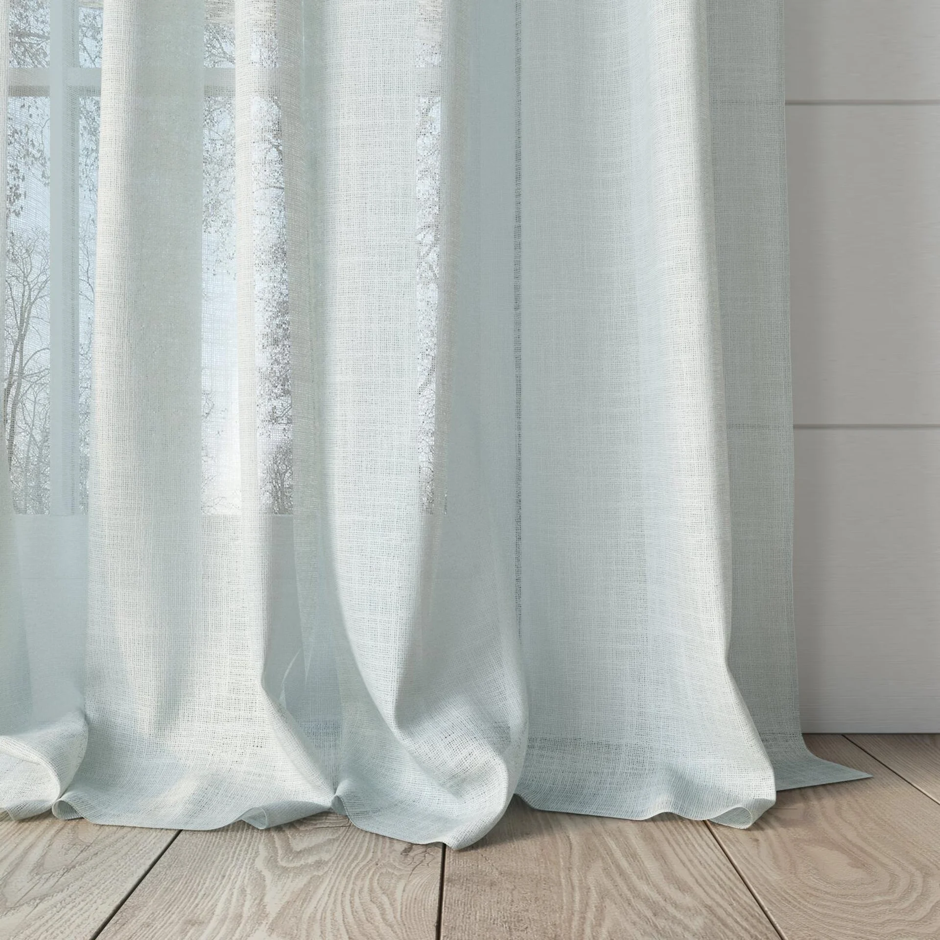 Bottom view of Verdant Cream, puddled, on curtain rod