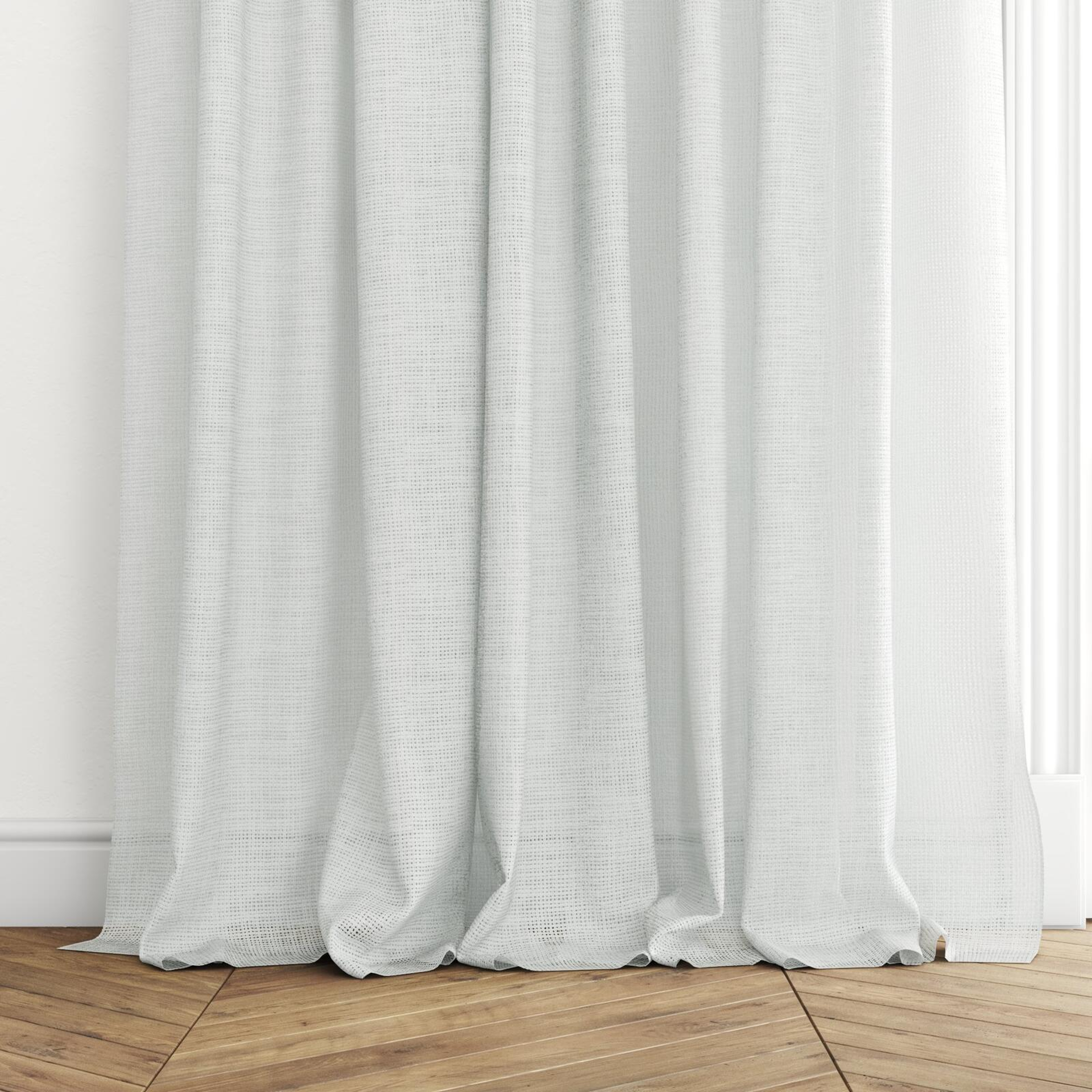 Bottom view of Threaded Wool, puddled with pinch pleat, on curtain rod