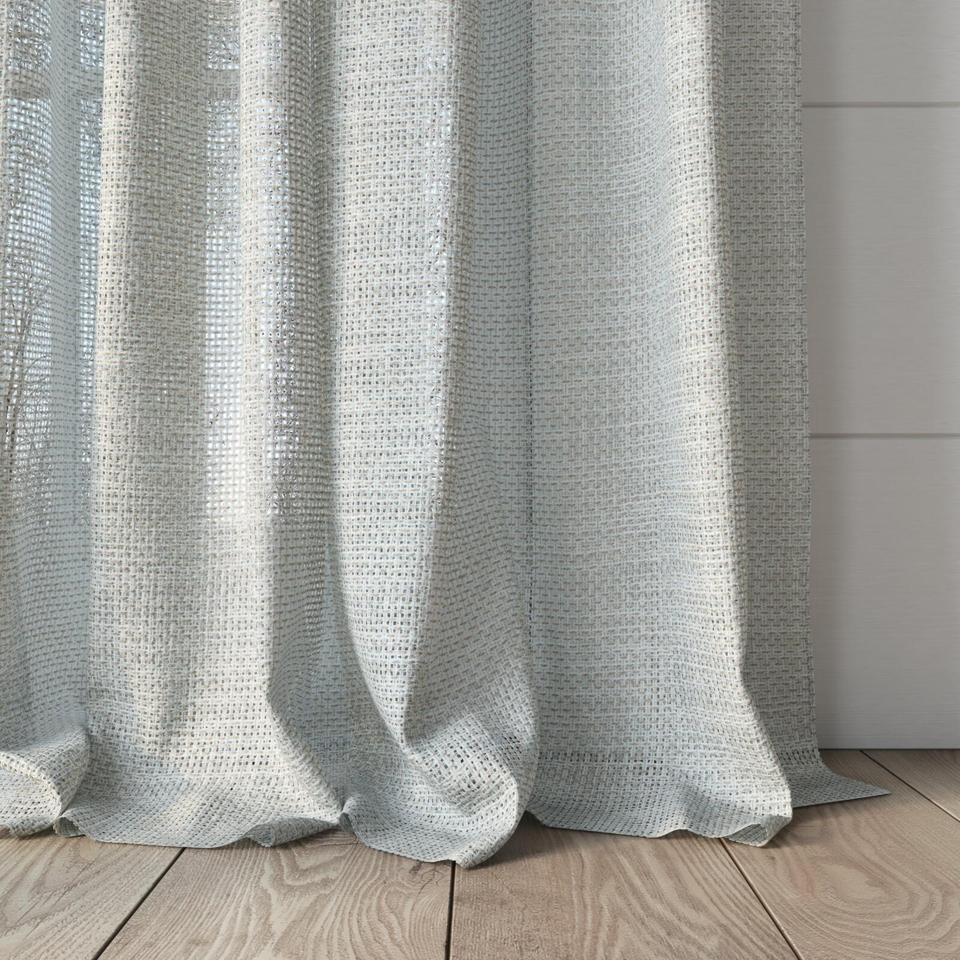 Bottom view of Threaded Taupe, puddled, on curtain rod