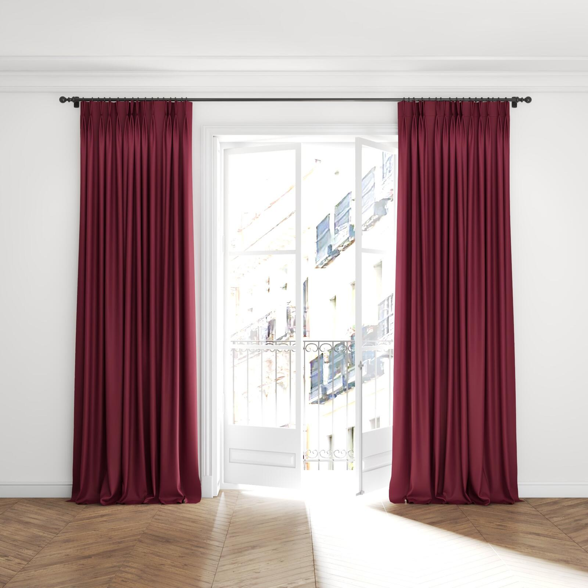 Full view of Ultra Dim Port, puddled with pinch pleat, on curtain rod