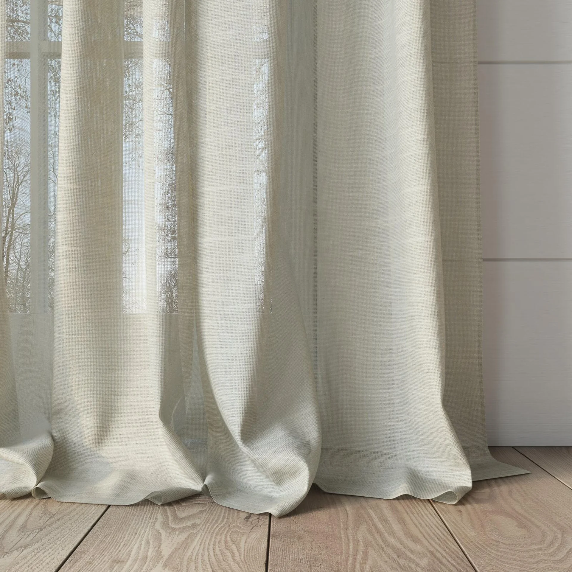 Bottom view of Angelic Raffia, puddled, on curtain rod