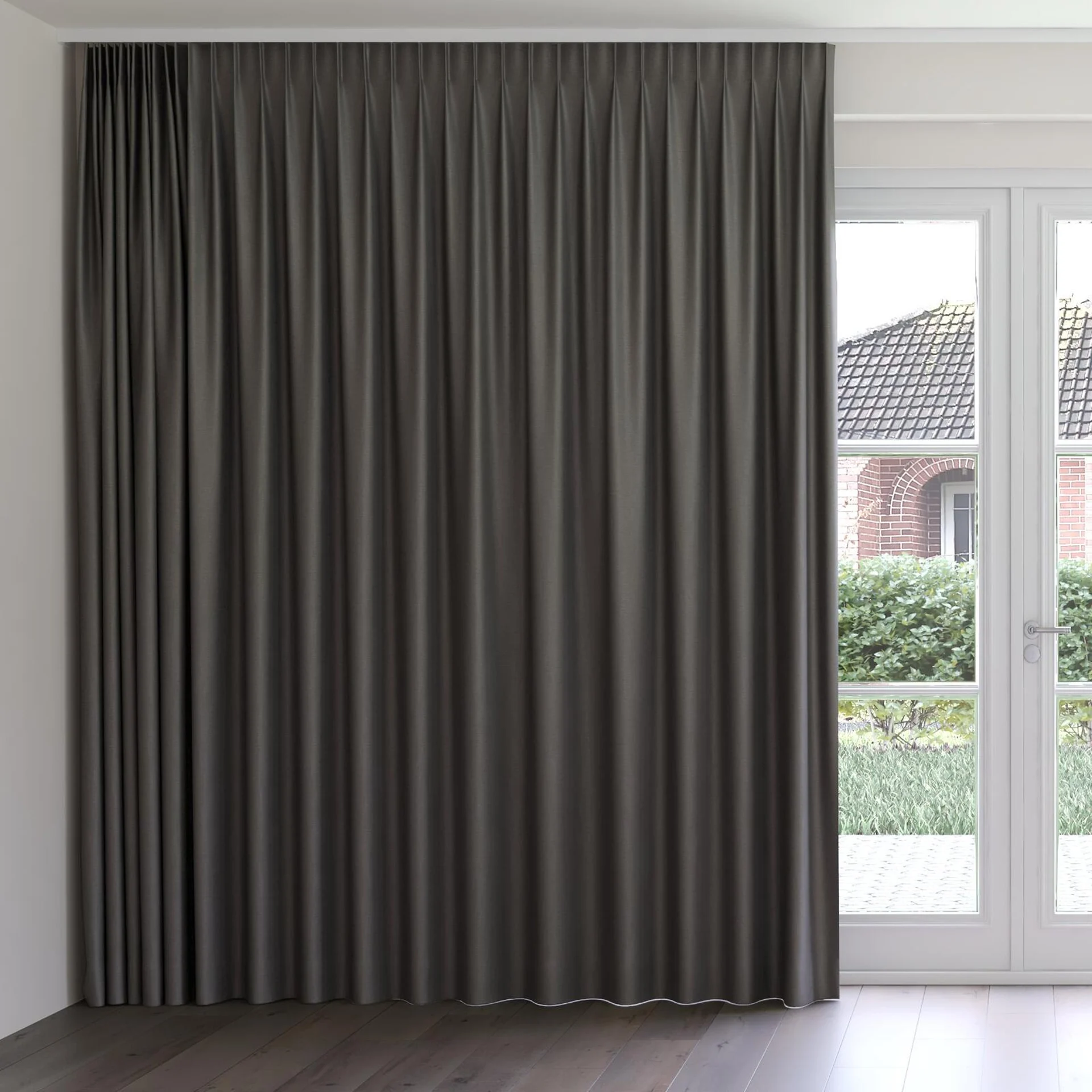 Front view of Eclipse FR Blackout Charcoal, on curtain rail