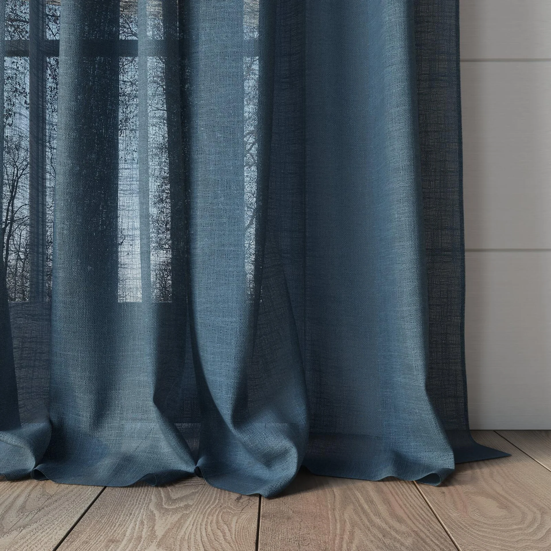 Bottom view of Verdant Denim, puddled, on curtain rod