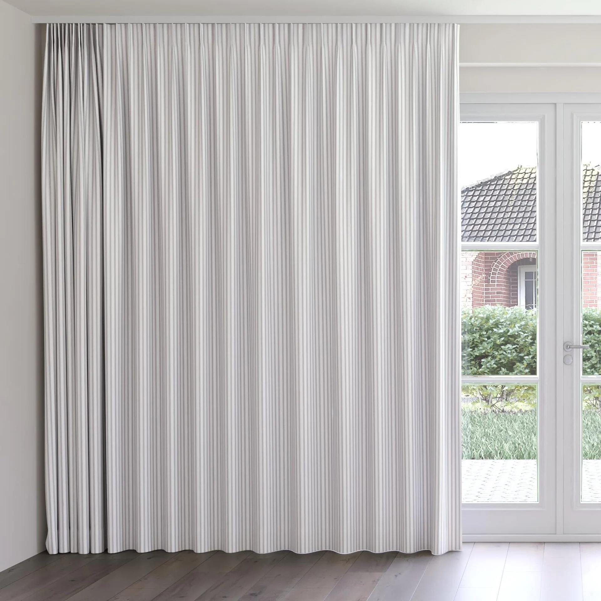 Front view of Chambray Ticking Black, on curtain rail