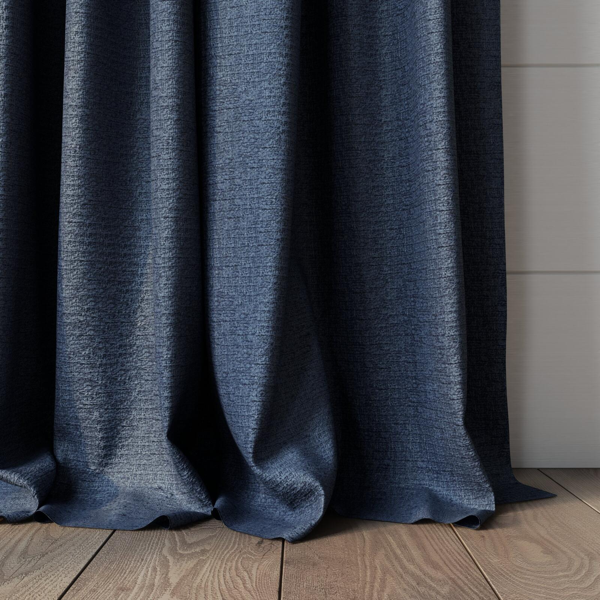 Bottom view of Monsieur Denim, puddled, on curtain rod