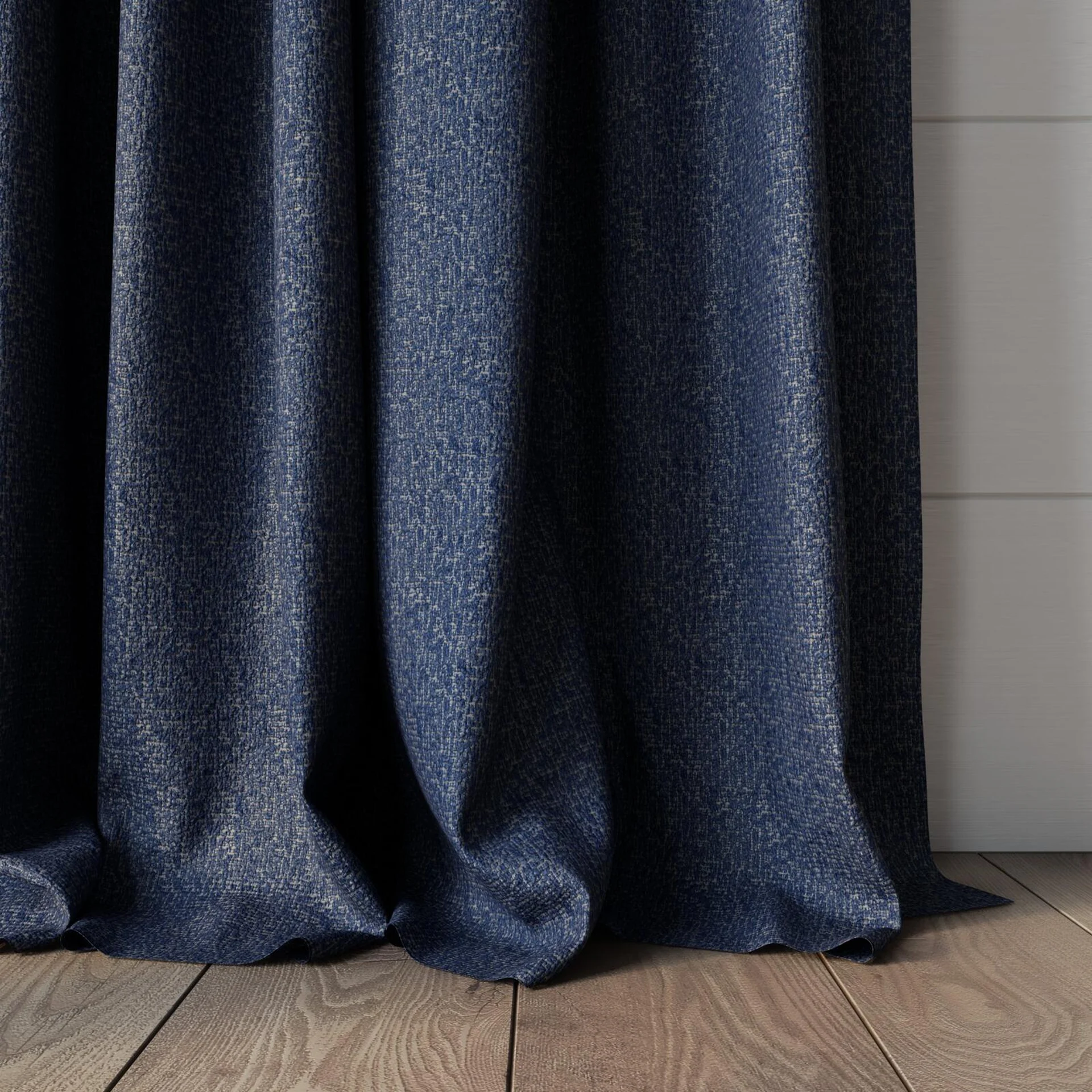 Bottom view of Sabik Indigo, puddled, on curtain rod