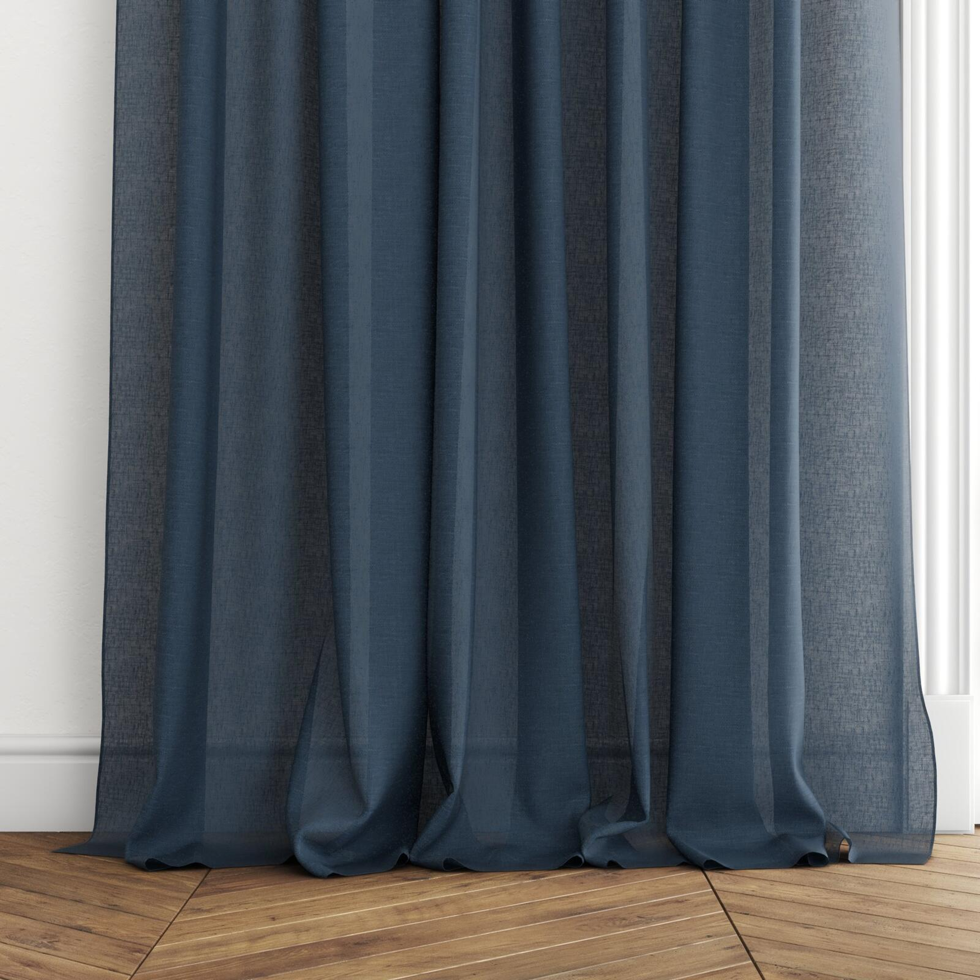 Bottom view of Elevate Shibori, puddled with pinch pleat, on curtain rod