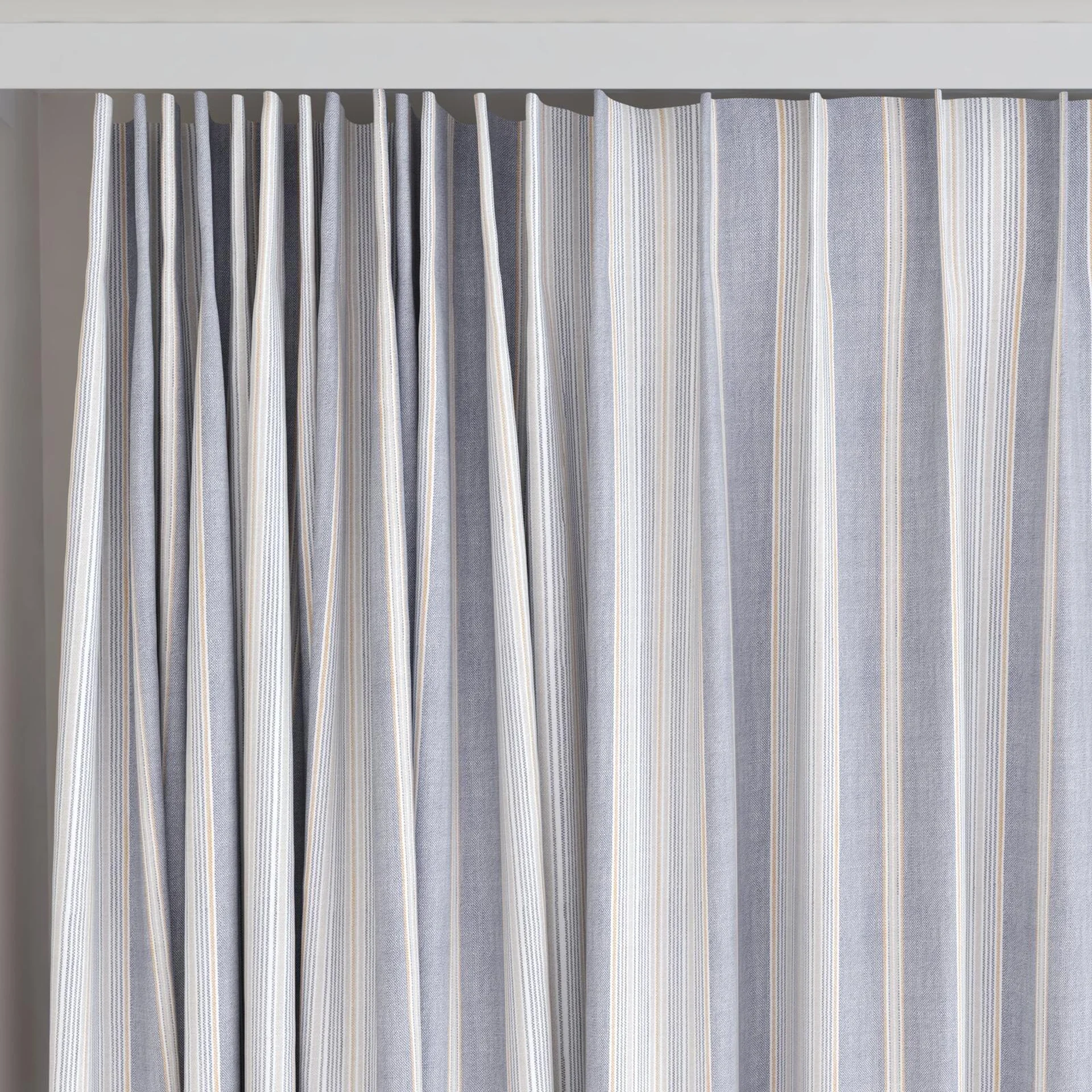 Top view of Chambray Multi Denim, on curtain rail