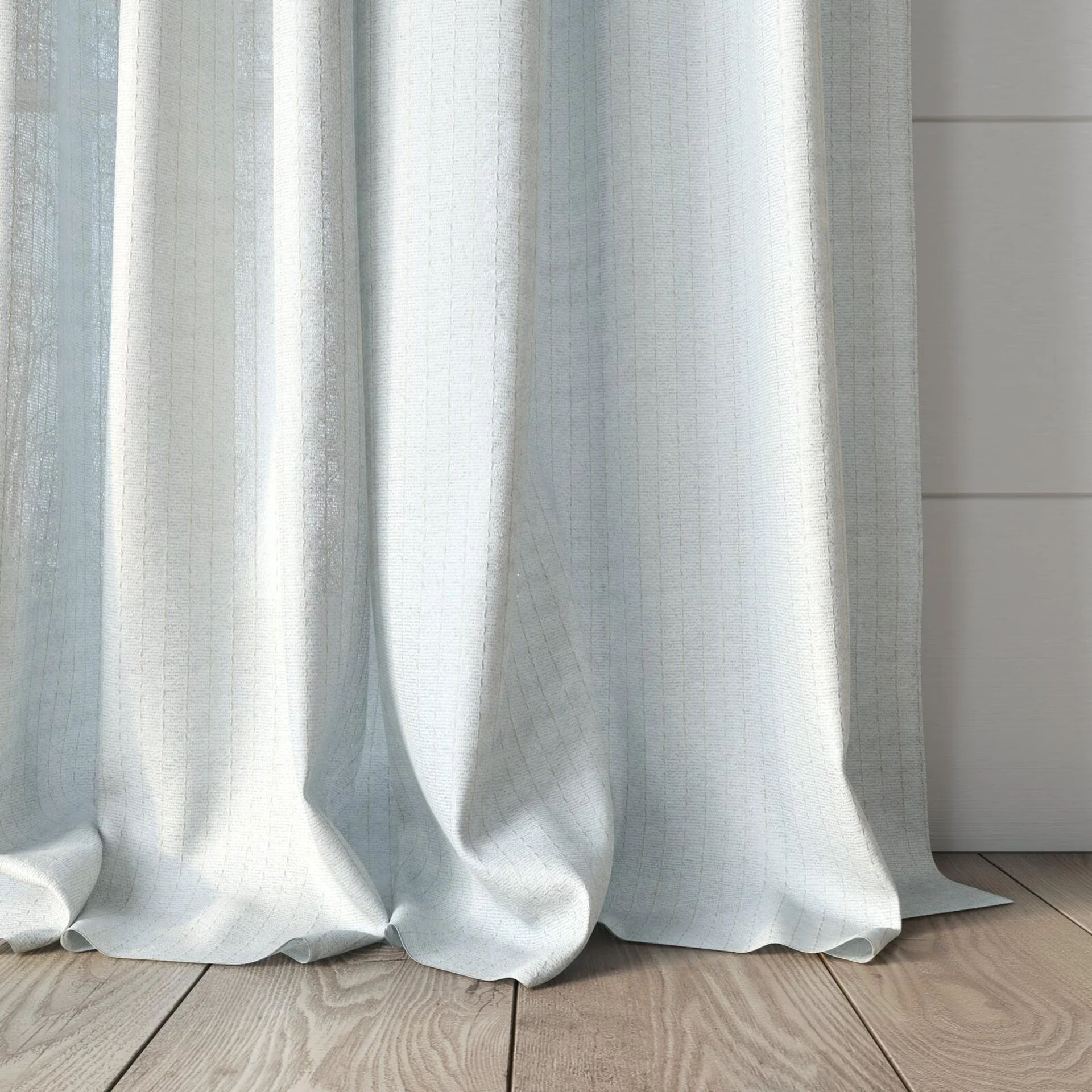 Bottom view of Oscillate Ivory, puddled, on curtain rod