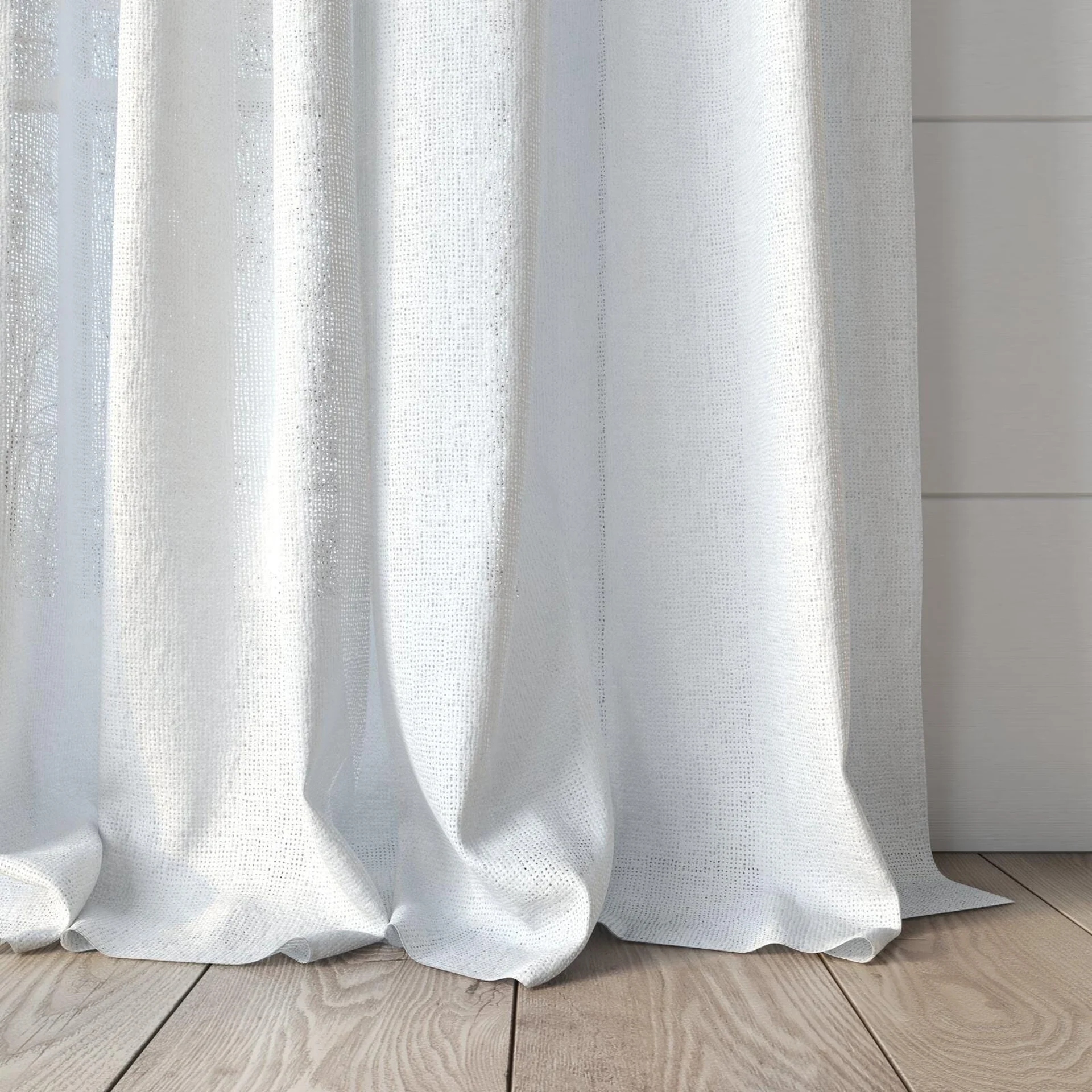 Bottom view of Mindful Blanc, puddled, on curtain rod