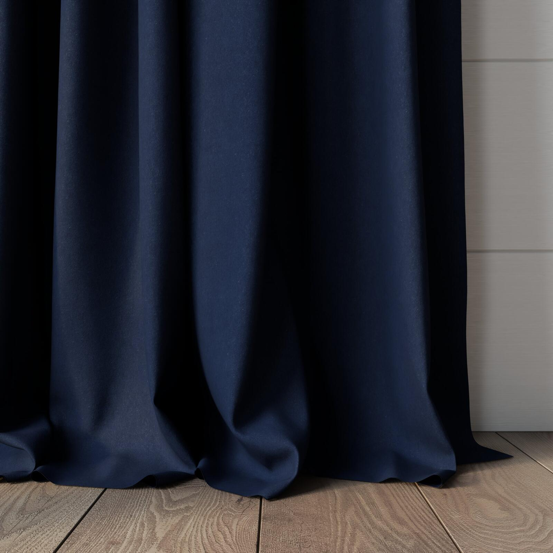 Bottom view of Lech Denim, puddled, on curtain rod