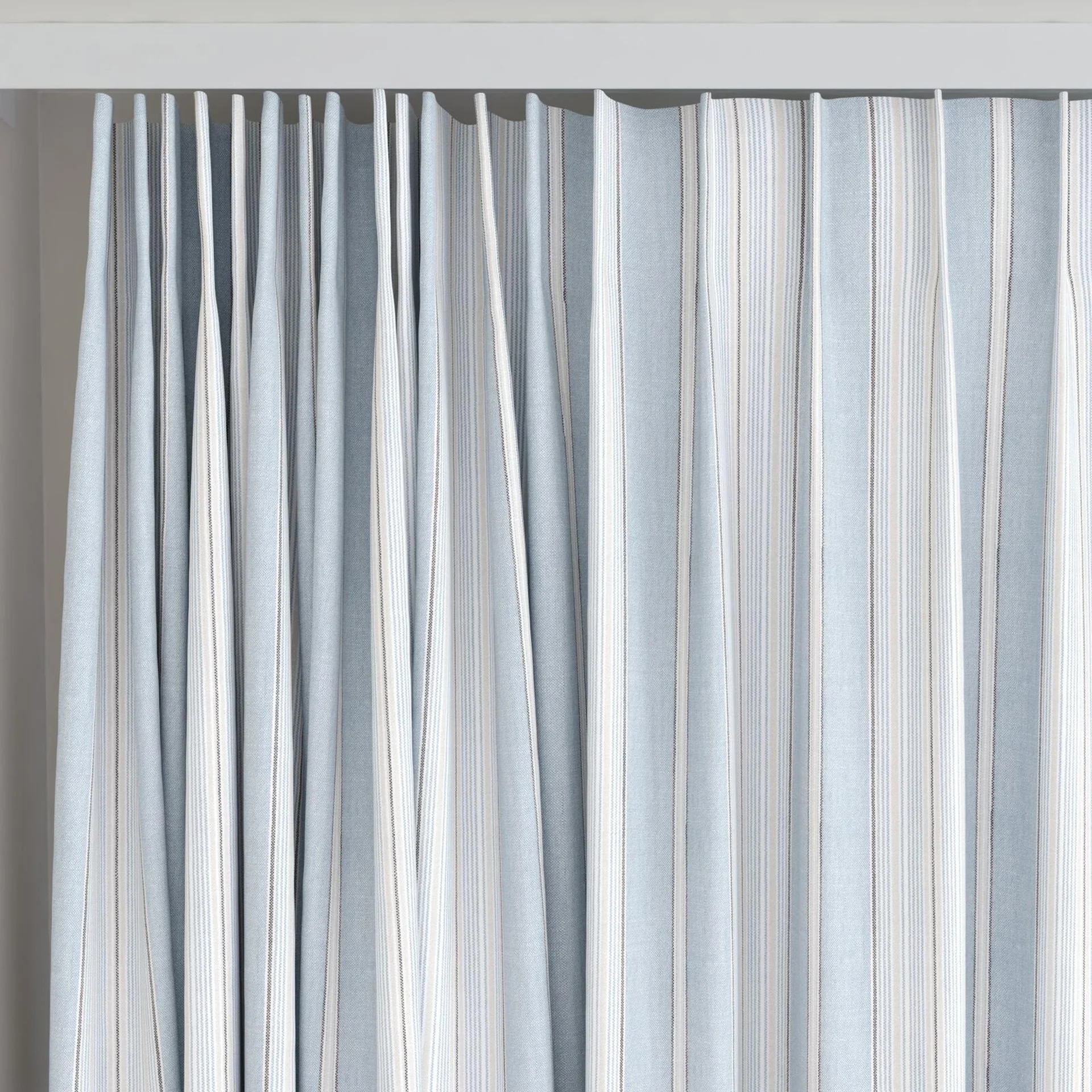 Top view of Chambray Multi Sky Blue, on curtain rail