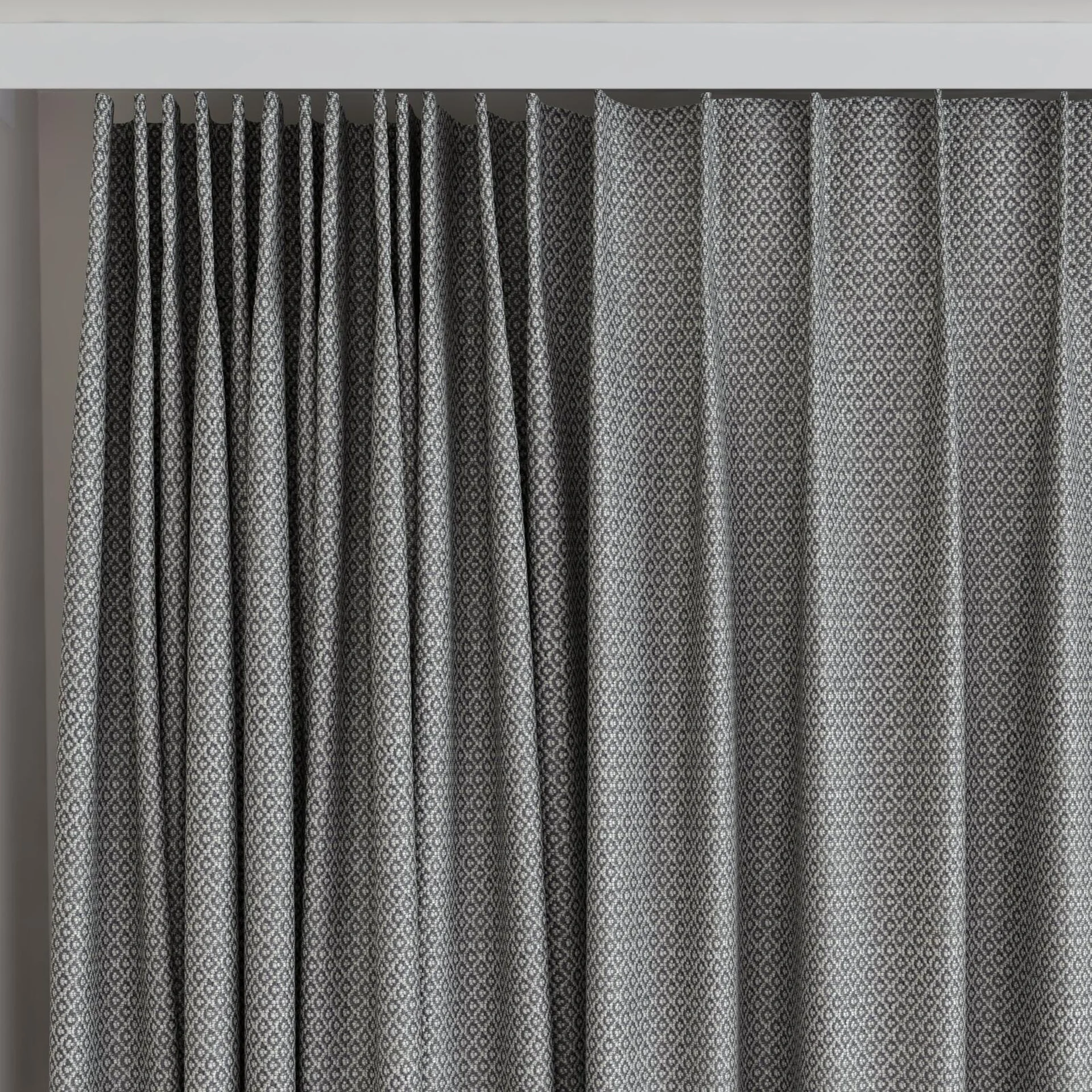Top view of Emoticon Charcoal, on curtain rail