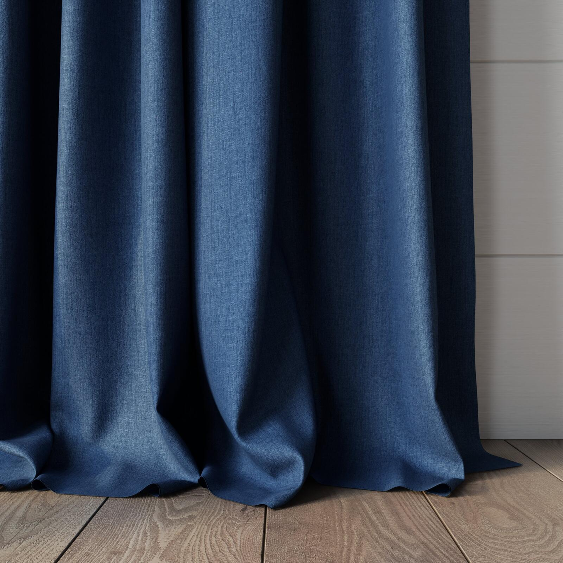 Bottom view of Cushy Denim, puddled, on curtain rod