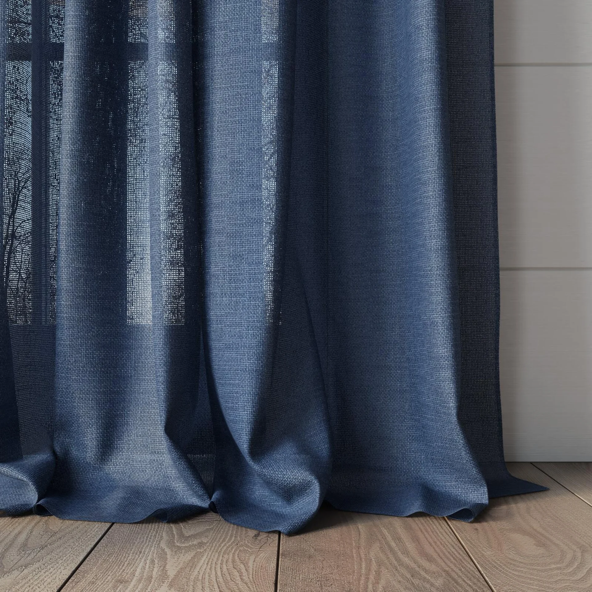 Bottom view of Focus Denim, puddled, on curtain rod
