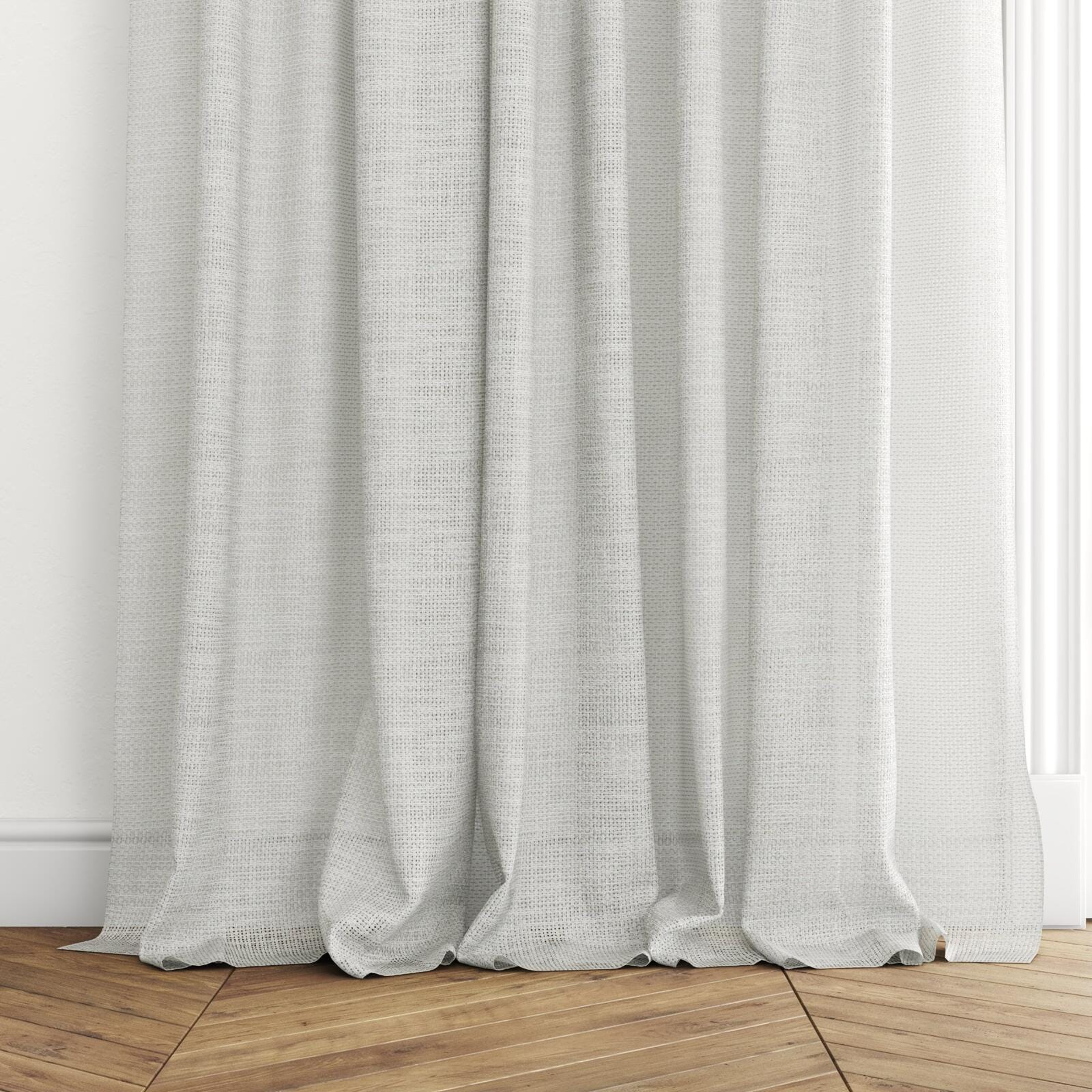Bottom view of Threaded Taupe, puddled with pinch pleat, on curtain rod