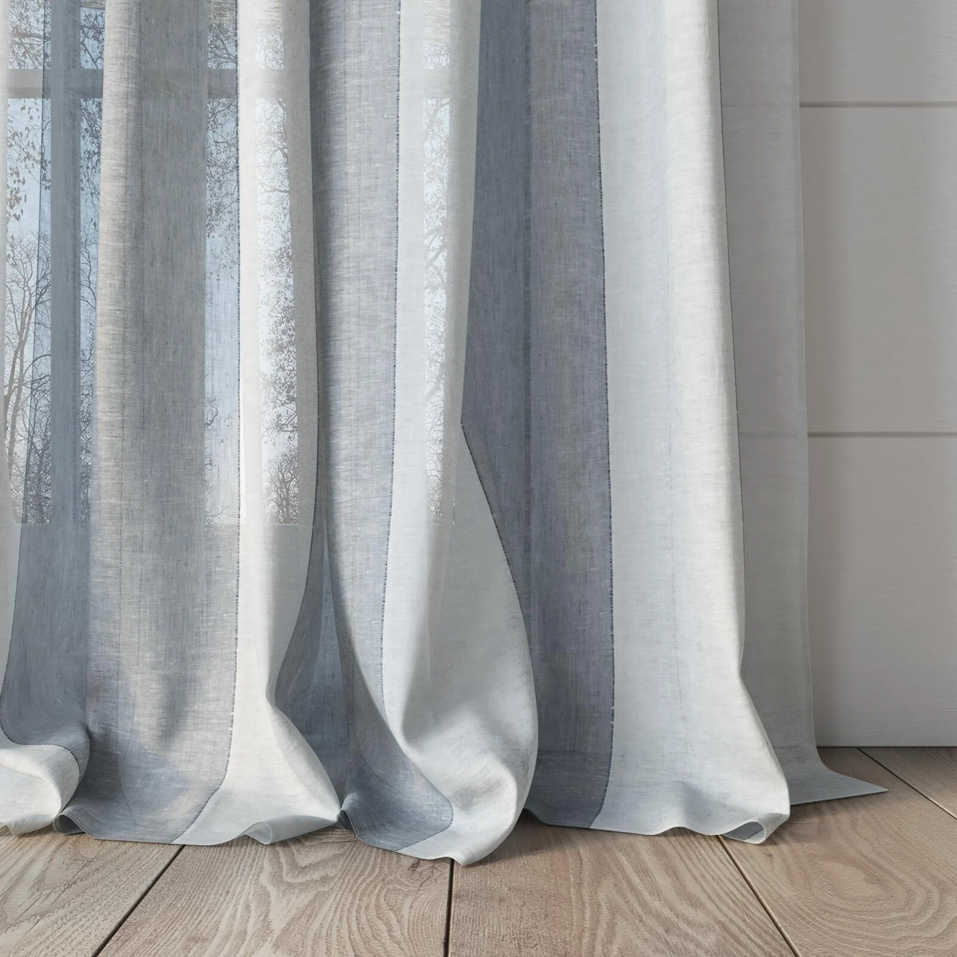 Bottom view of Kyoto Stripe Chambray, puddled, on curtain rod