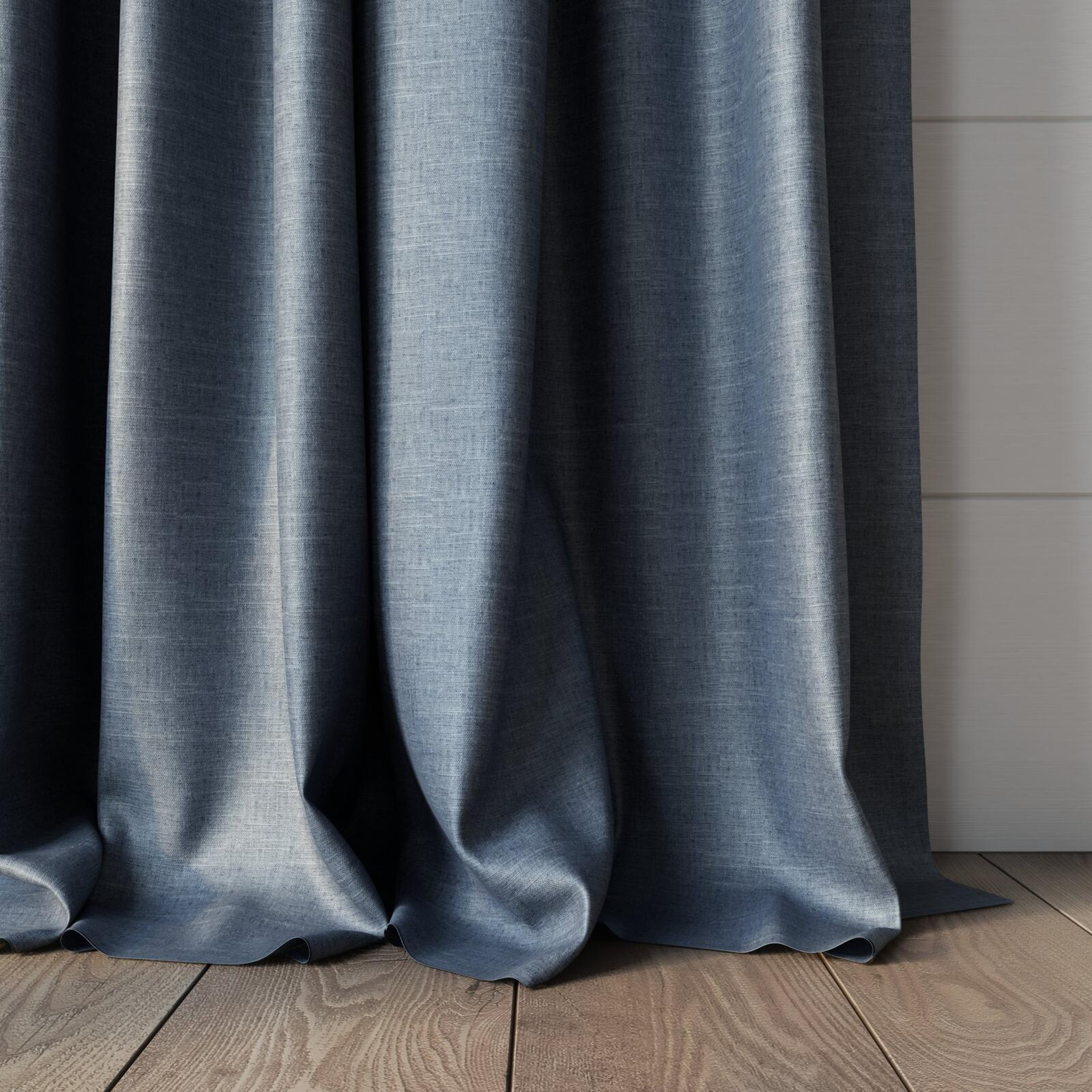 Bottom view of Tonto Denim, puddled, on curtain rod