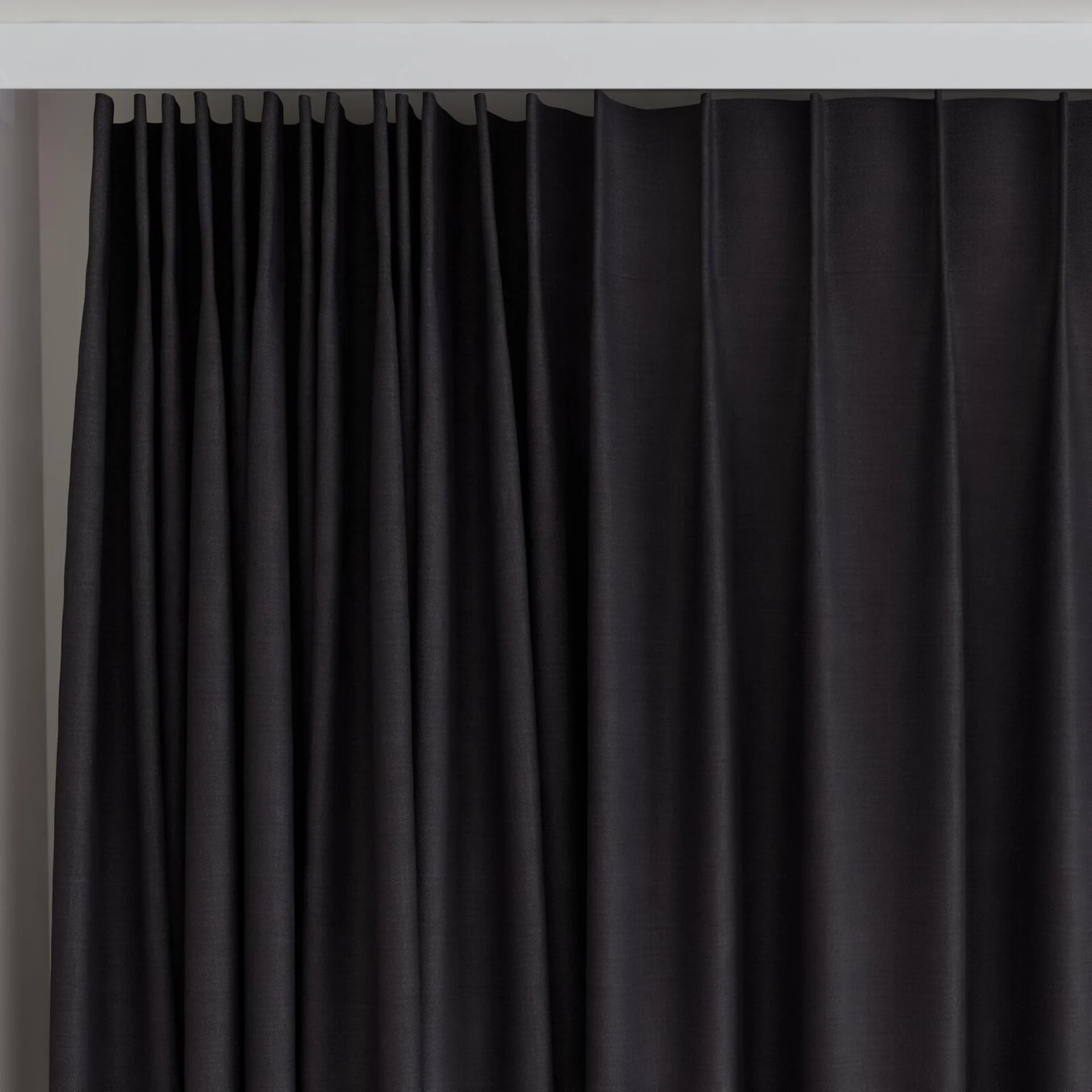 Top view of Loci Dim Out Onyx, on curtain rail