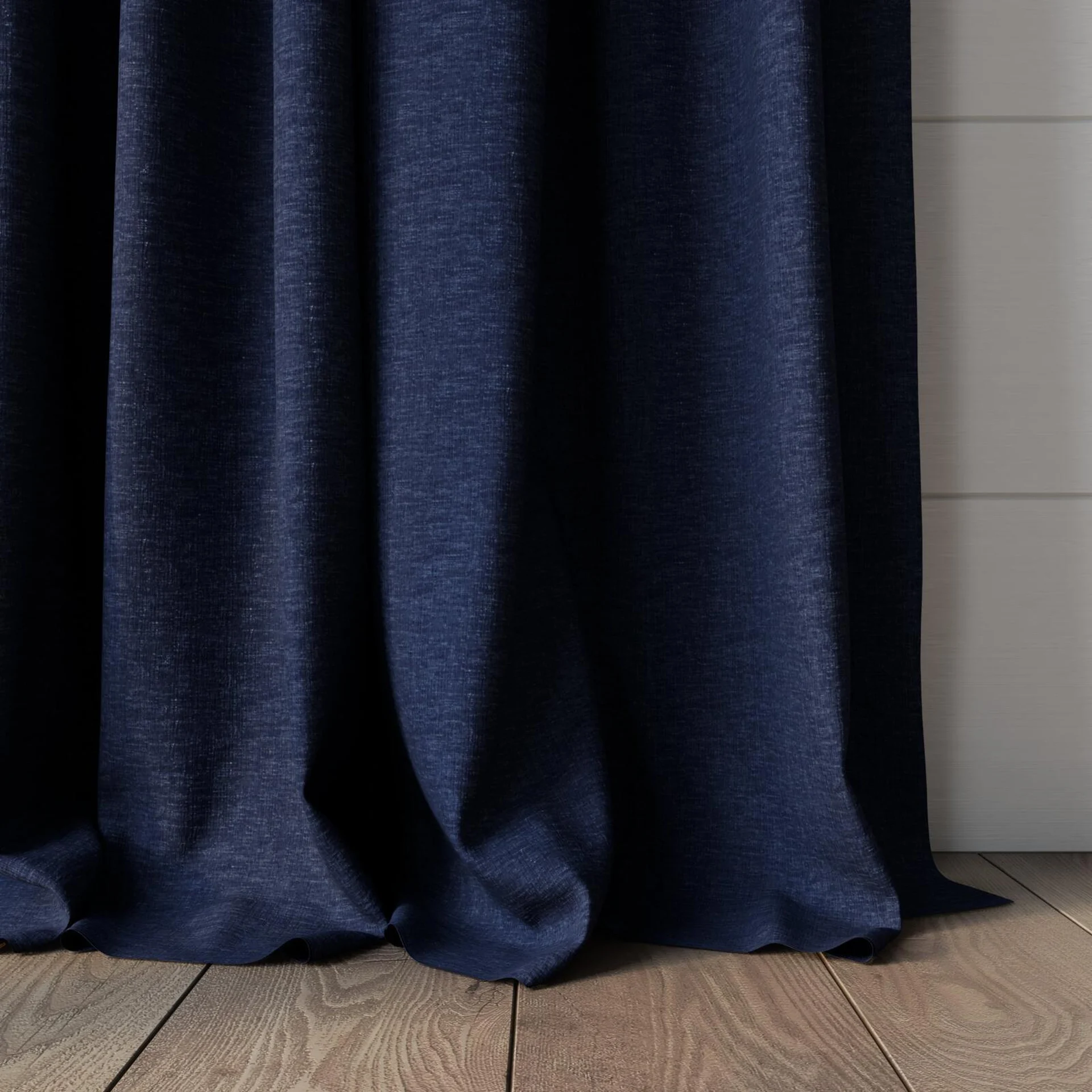 Bottom view of Coverlet Denim, puddled, on curtain rod