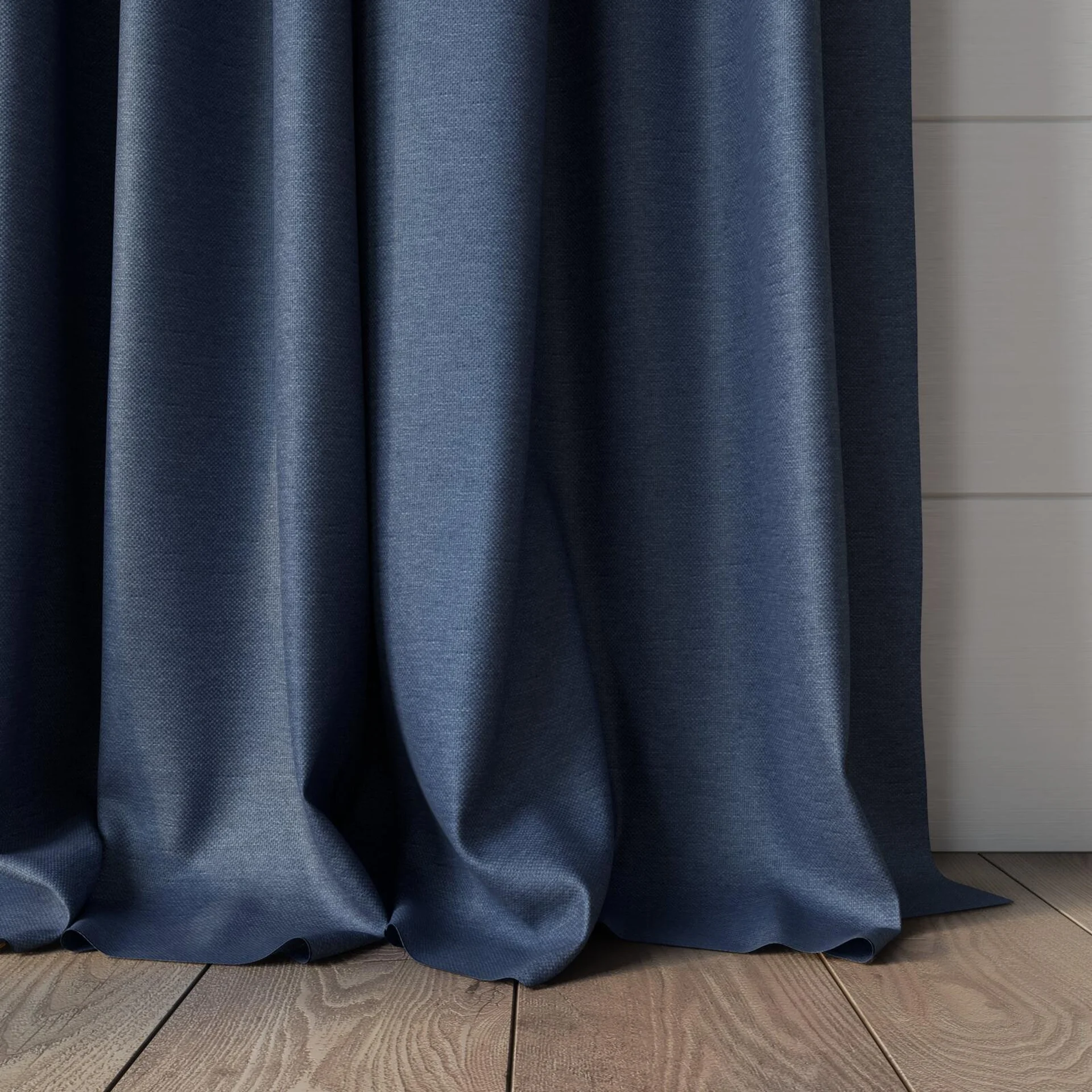 Bottom view of Duede Indigo, puddled, on curtain rod