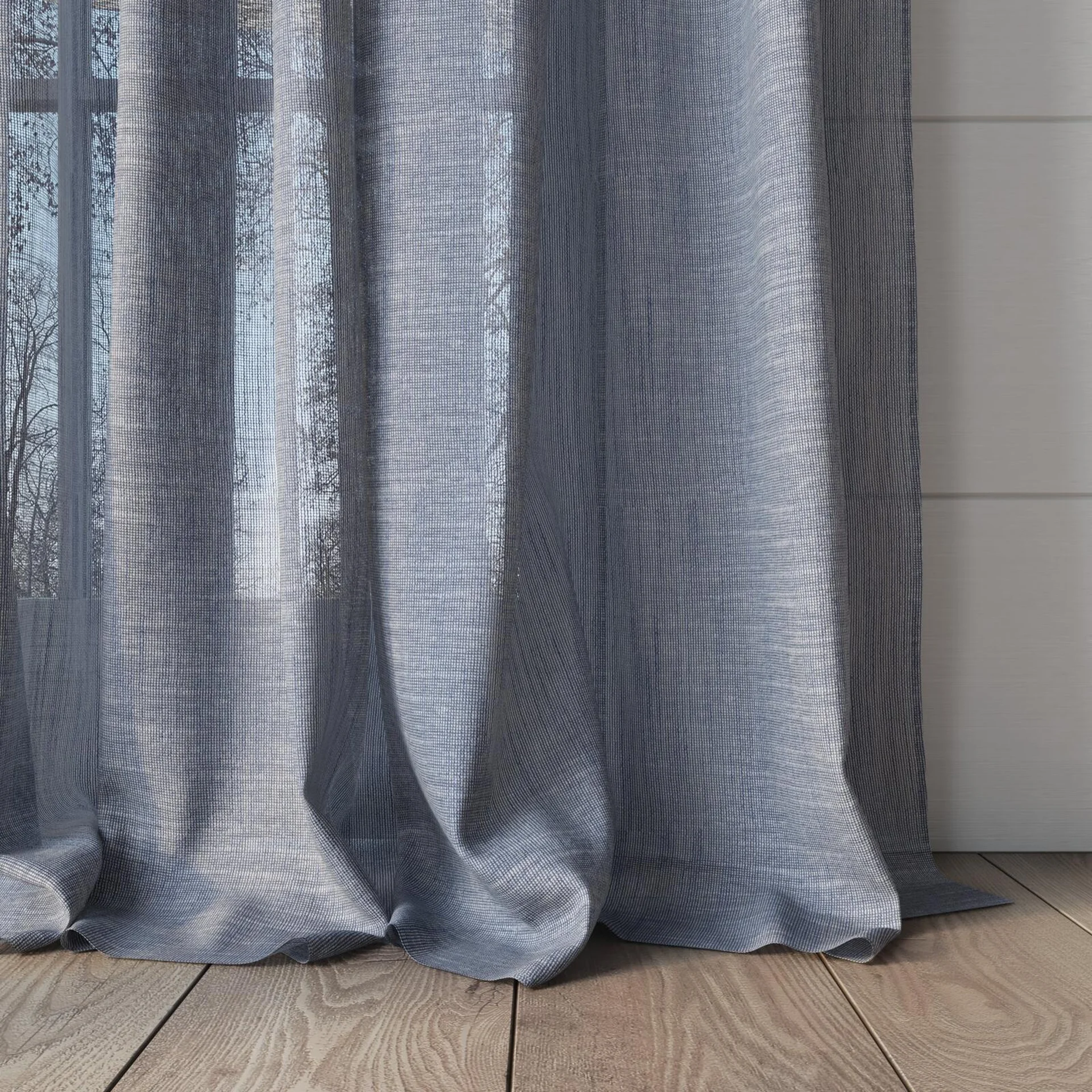 Bottom view of Angelic Denim, puddled, on curtain rod