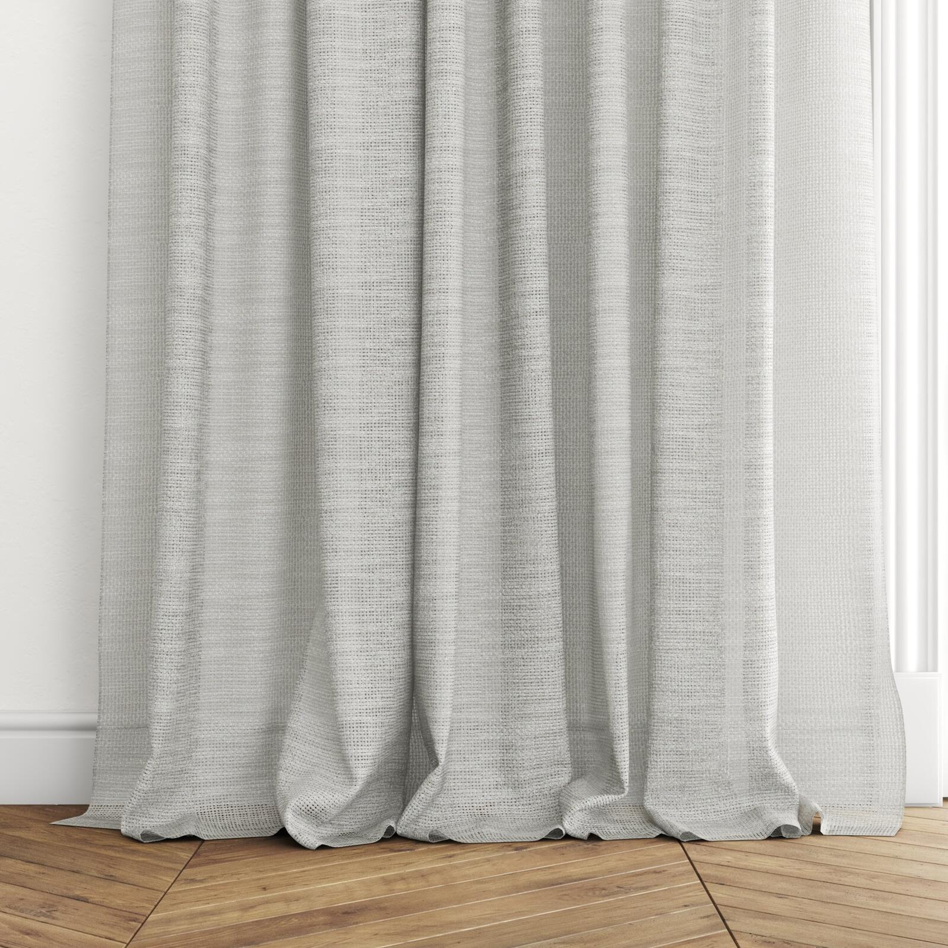 Bottom view of Threaded Silver, puddled with pinch pleat, on curtain rod