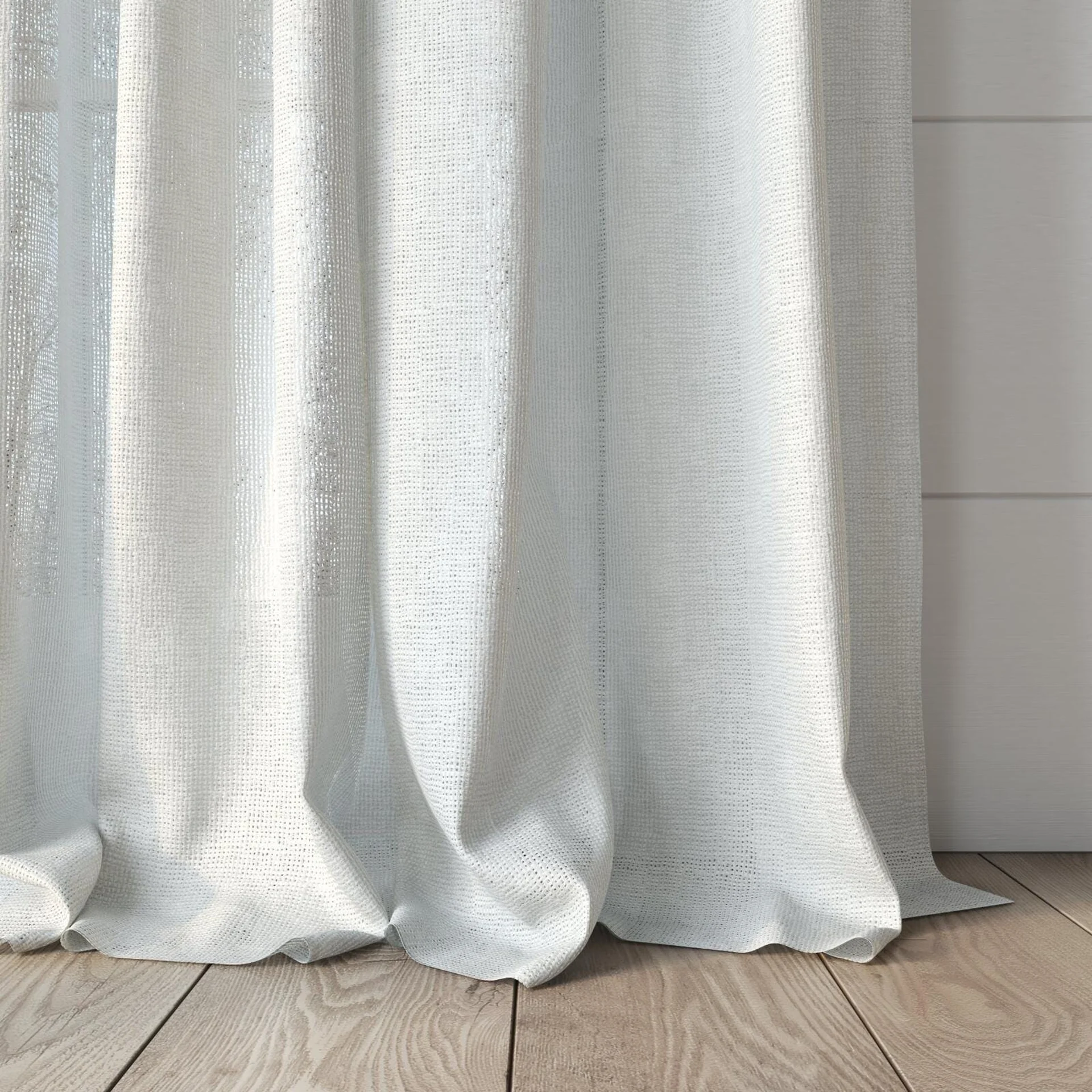 Bottom view of Mindful Natural, puddled, on curtain rod