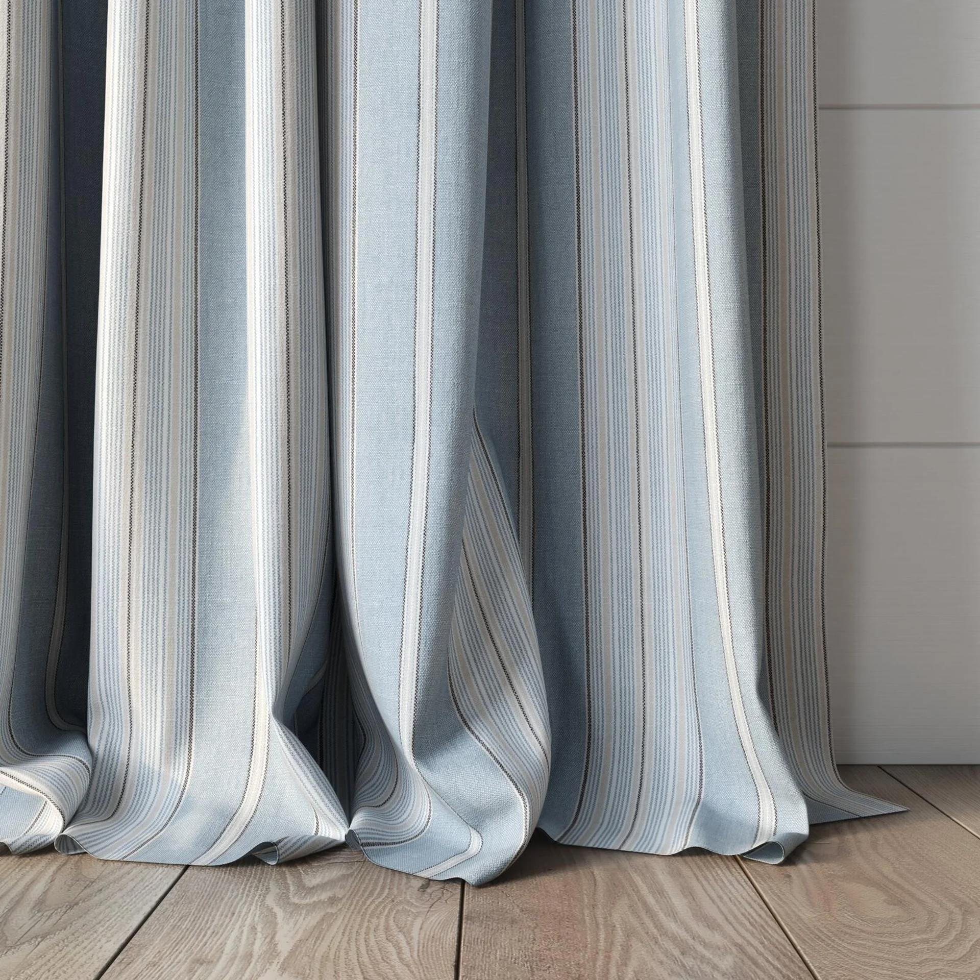 Bottom view of Chambray Multi Sky Blue, puddled, on curtain rod